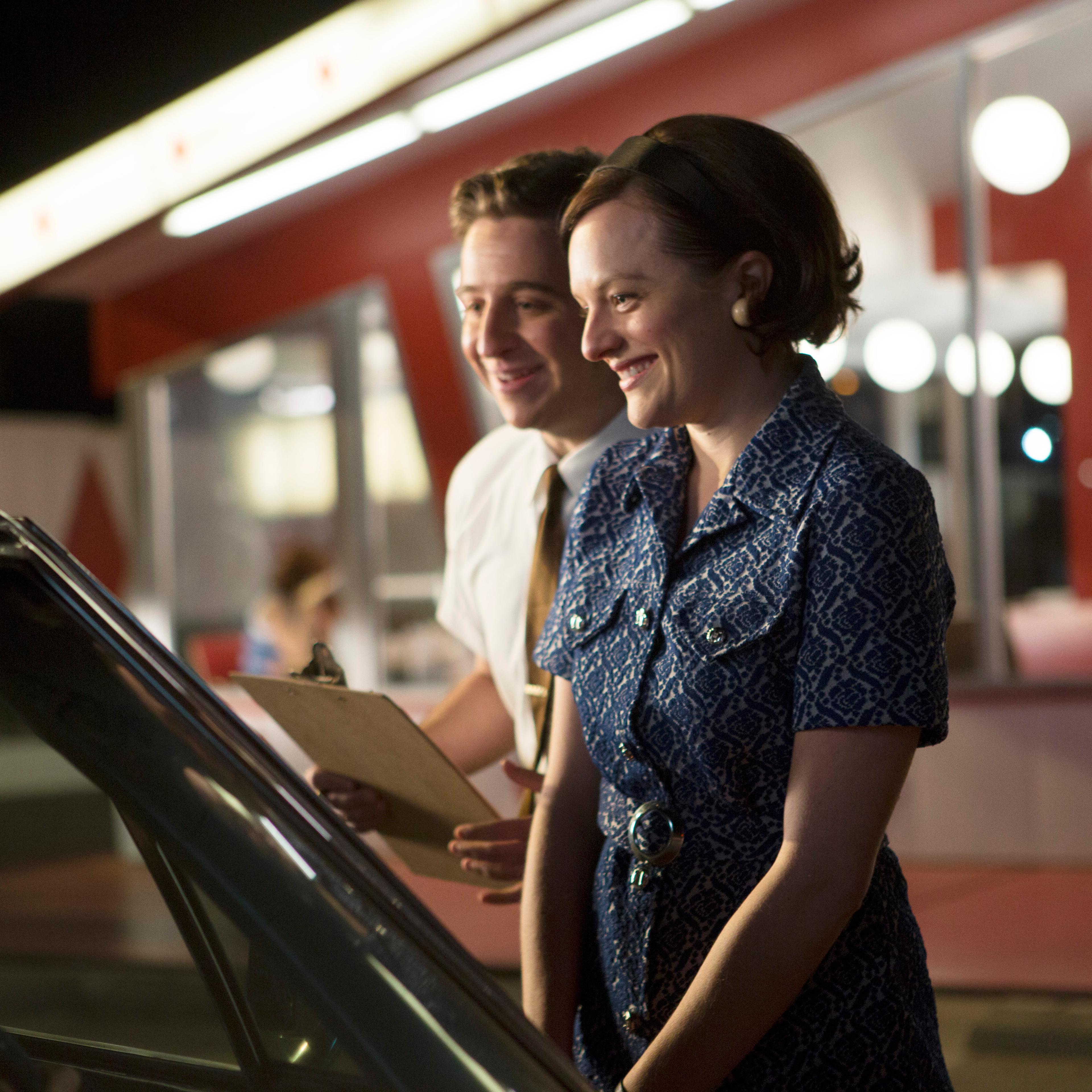 Trevor Einhorn as John Mathis and Elisabeth Moss as Peggy Olson - Mad Men _ Season 7, Episode 6 - Photo Credit; Justina Mintz/AMC