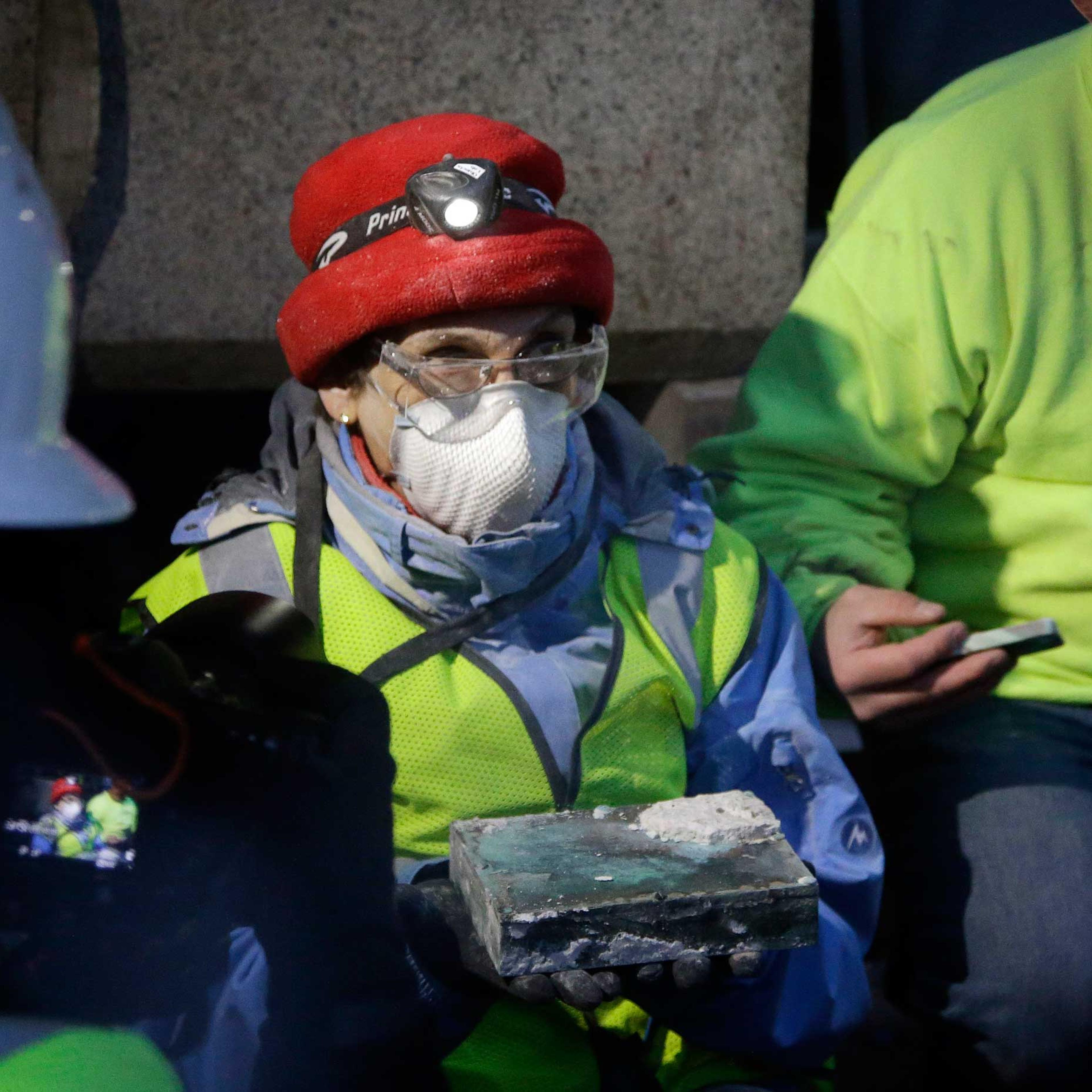 Pamela Hatchfield, a conservator at the Boston's Museum of Fine Arts, holds a time capsule she had just removed from the cornerstone of the Statehouse in Boston,, Dec. 11, 2014.