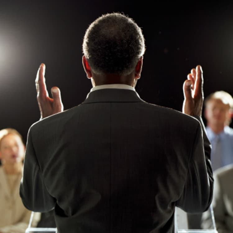 man-giving-speech-rear-view