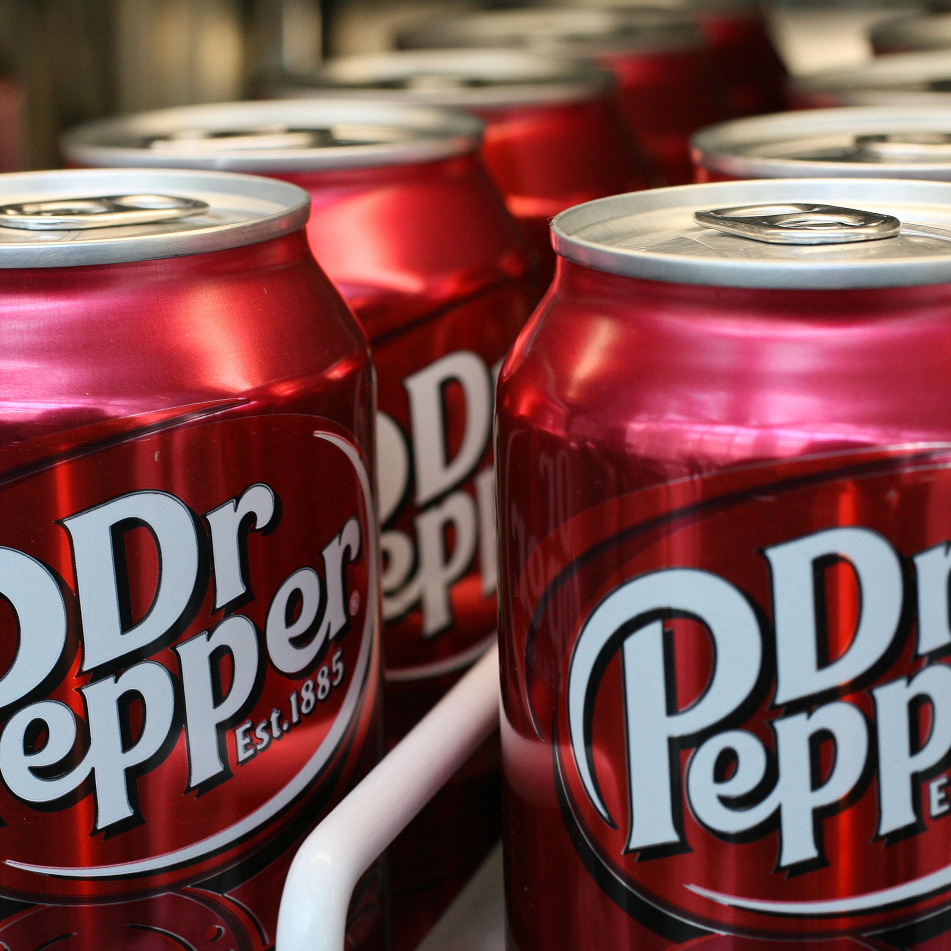 Cans of Dr Pepper sit on a pantry shelf in New York, Tuesday