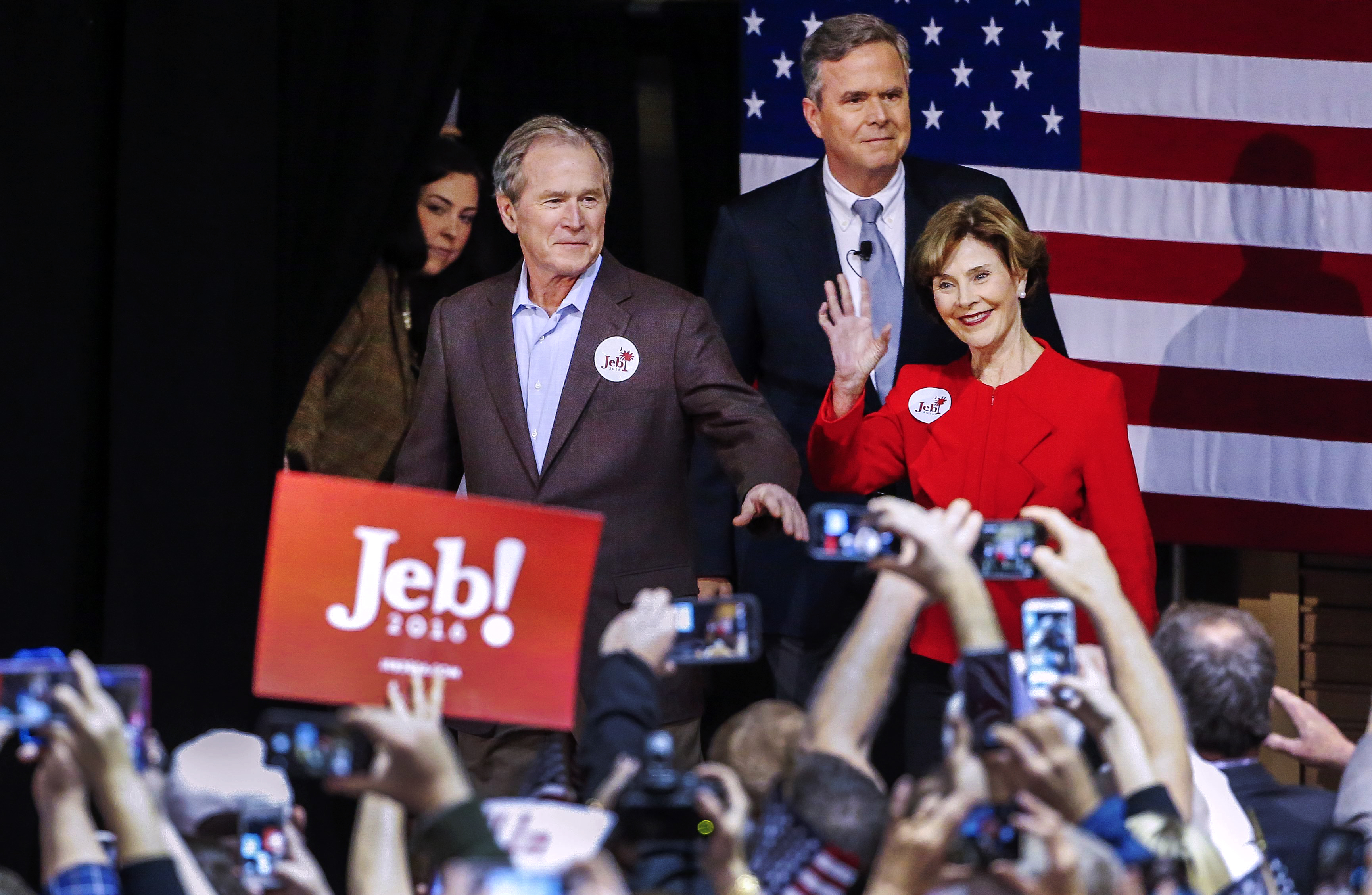 Republican presidential candidate and former Florida Gov. Jeb Bush, center, participates in a campaign event with brother, former President George W. Bush and former First Lady Laura Bush in North Charleston, S.C. on Feb. 15, 2016.