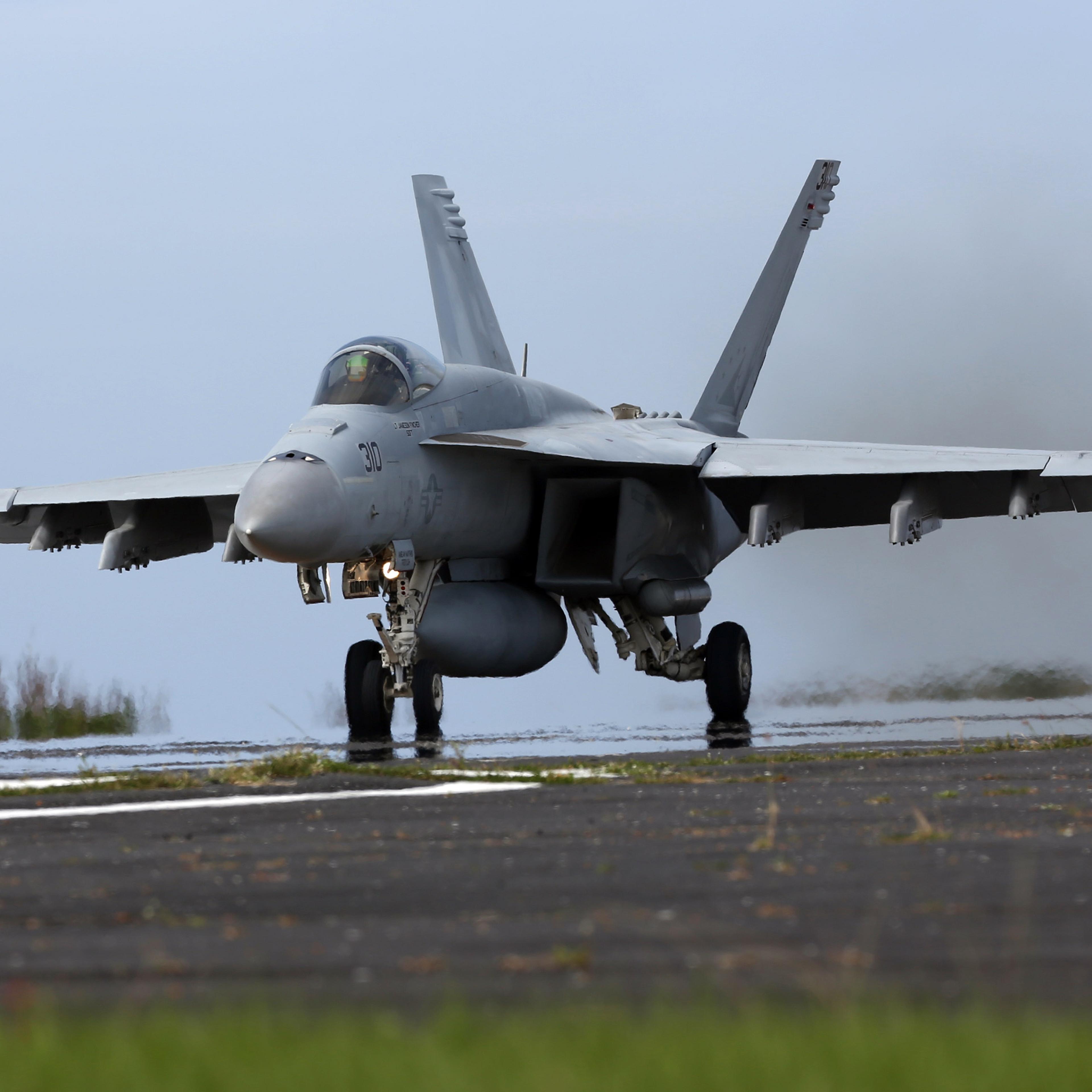 U.S. Navy Conduct Field Carrier Landing Practice In Iwo Jima