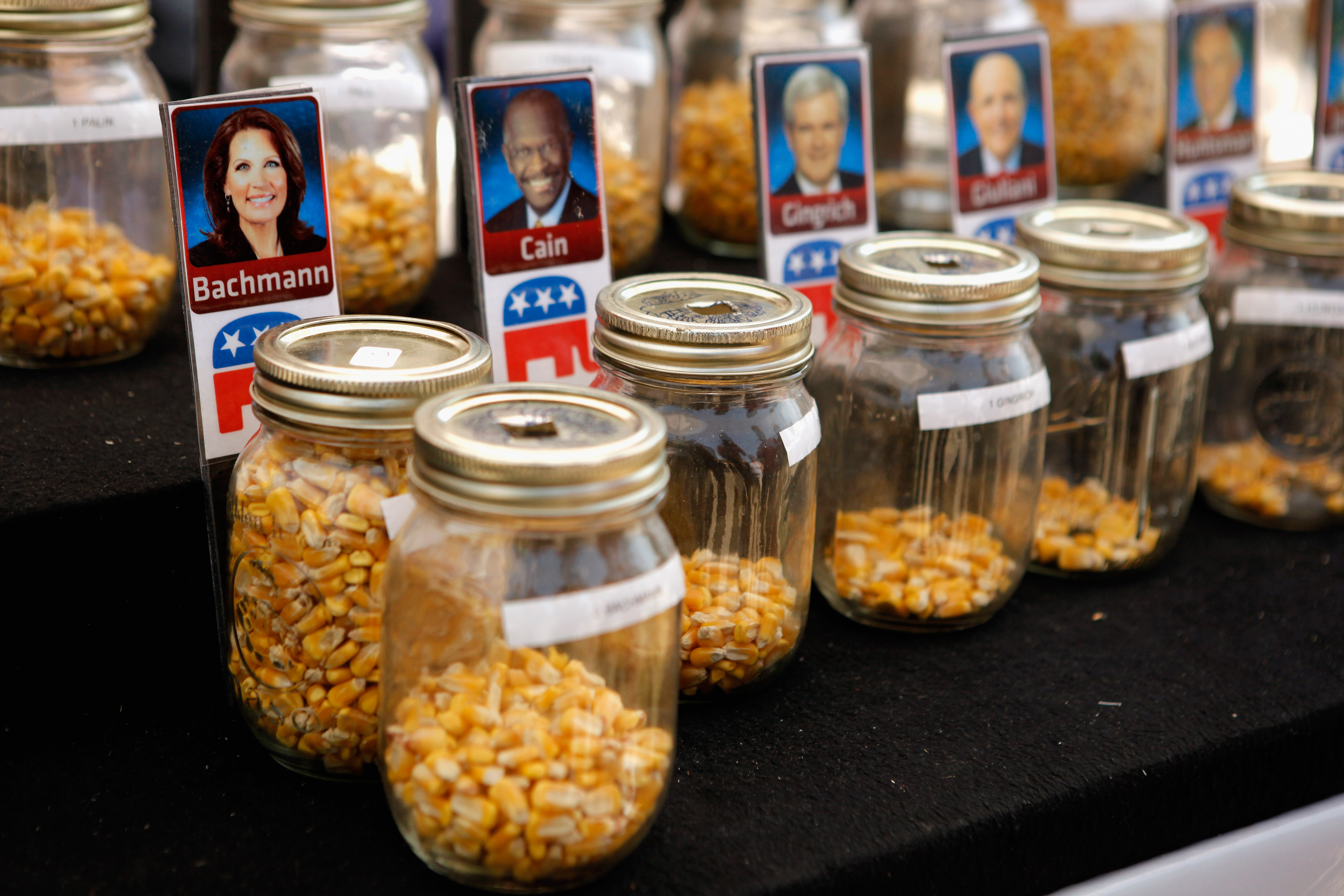Fairgoers over the age of 18 are invited to drop one piece of corn into one of 14 jars with photos of their favorite Republican presidential candidate during the second day of the Iowa State Fair ahead of the Iowa Straw Poll on Aug. 12, 2011 in Des Moine