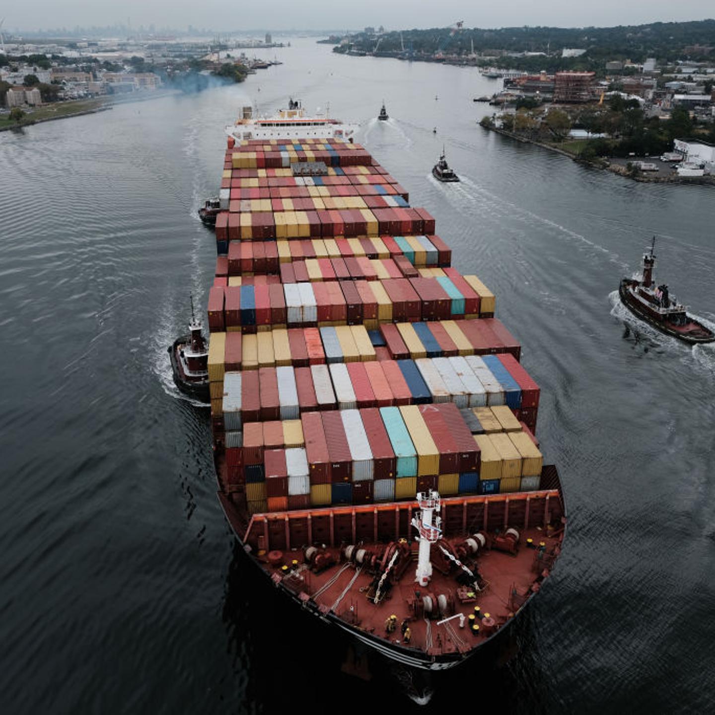 A cargo ship moves under the Bayonne Bridge as it heads into port on October 13, 2021 in Bayonne, New Jersey.