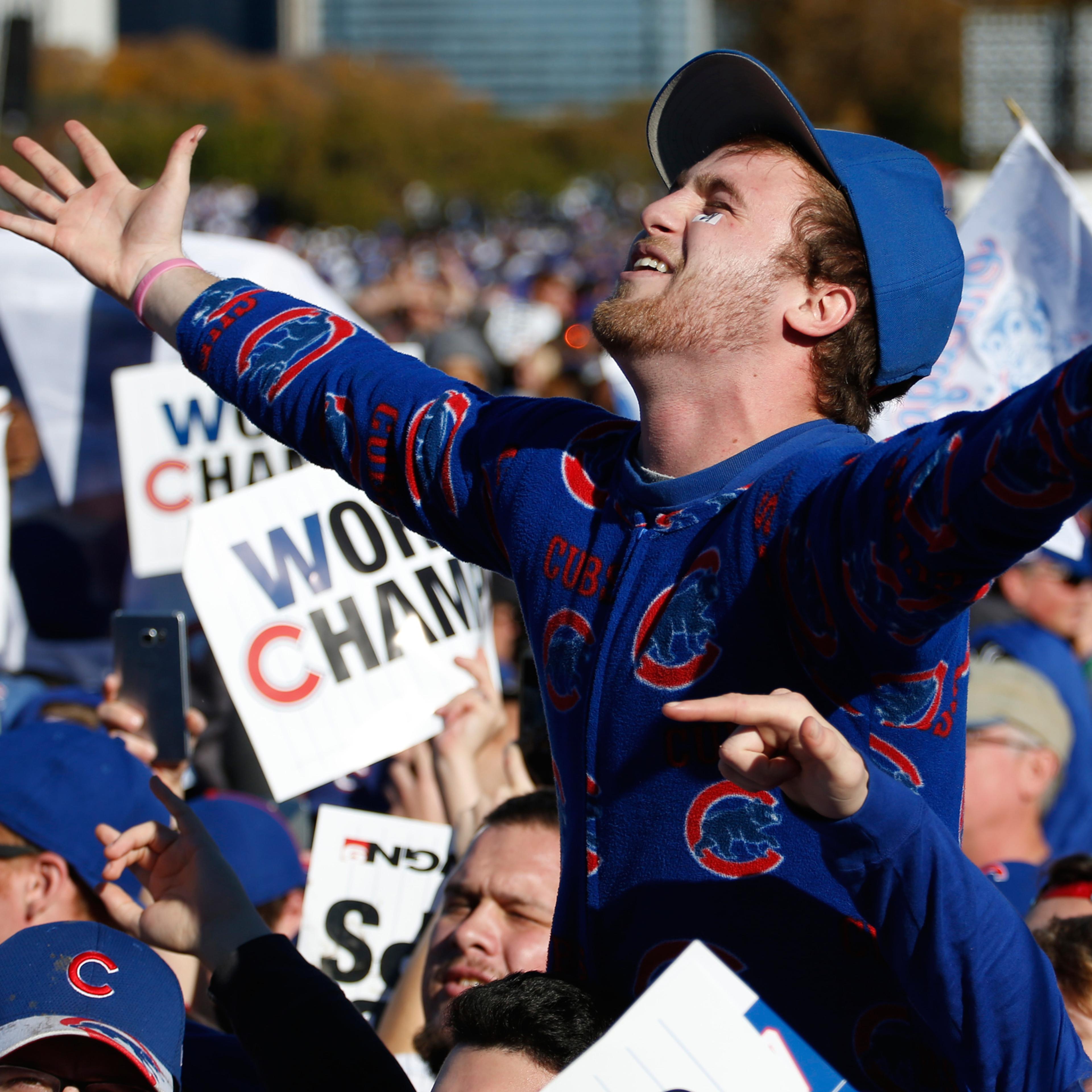 Chicago Cubs fans celebrate before a rally in Grant Park honoring the World Series baseball champions in Chicago, Friday, Nov. 4, 2016. (AP Photo/Nam Y. Huh)