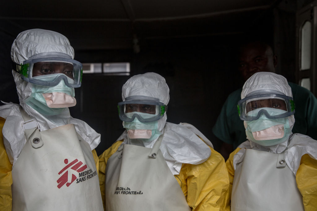 Medical staff dressed in protective gear before entering an