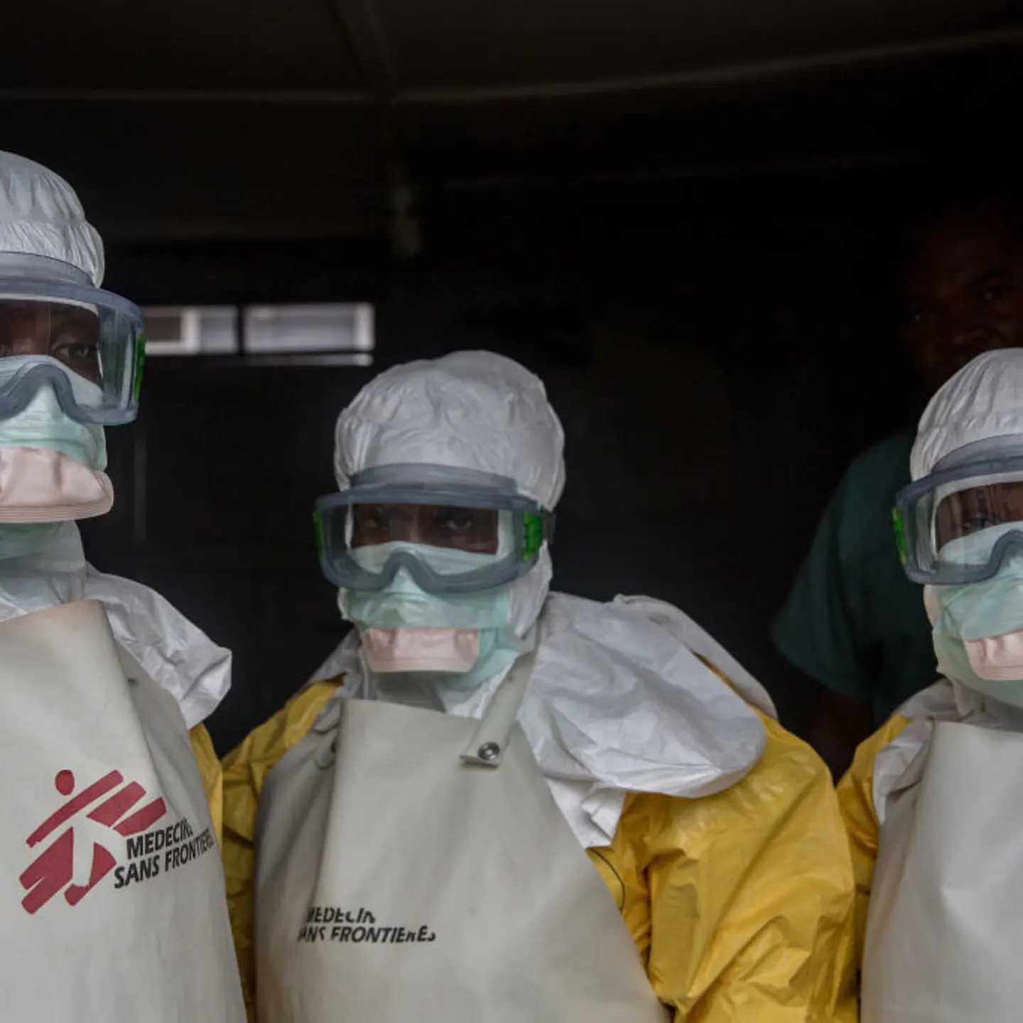 Medical staff dressed in protective gear before entering an