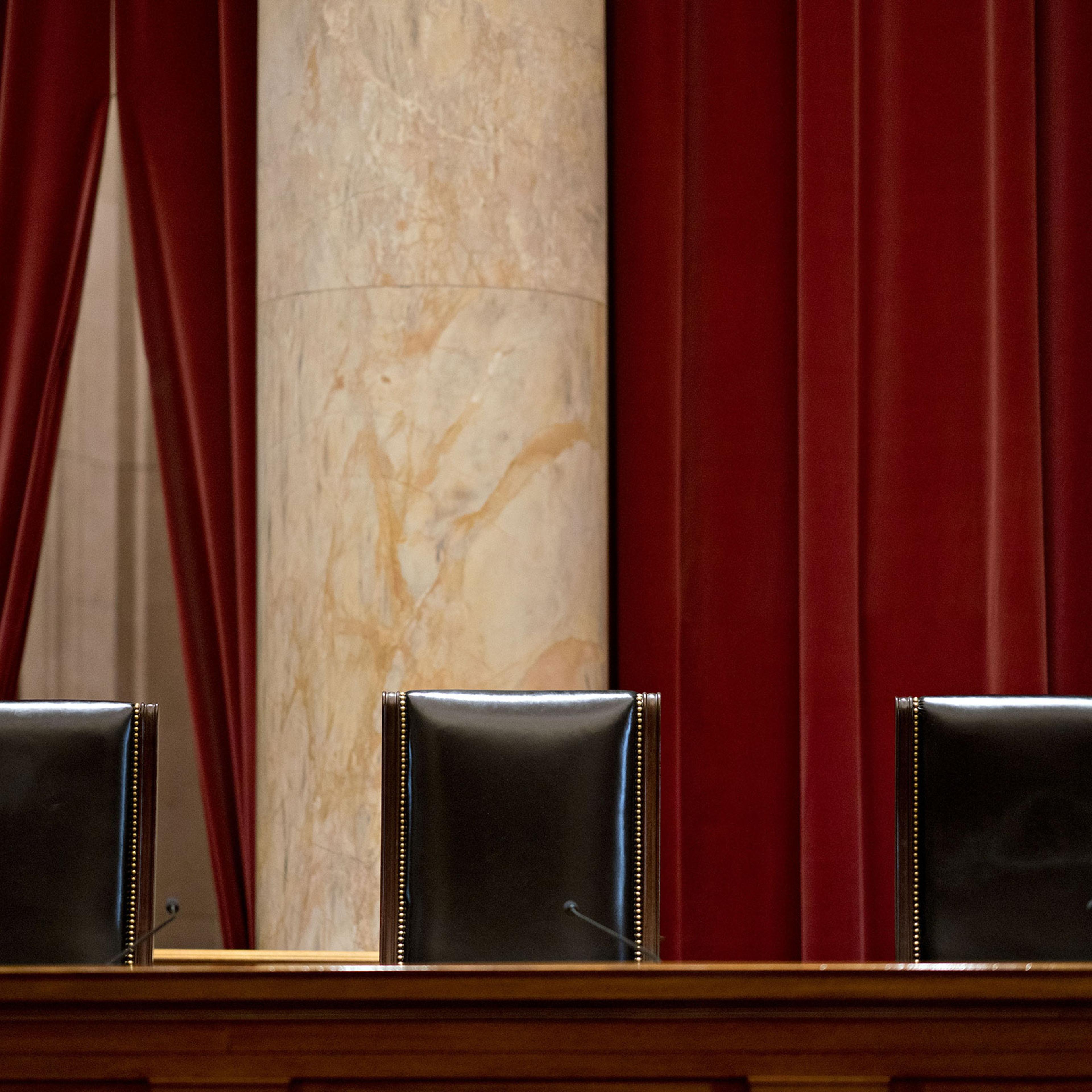 The chairs of U.S Supreme Court Justices Neil Gorsuch, from left, Sonia Sotomayor and Stephen Breyer sit behind the courtroom bench in Washington, on July 9, 2019.