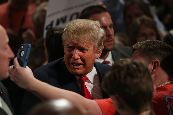 Republican presidential candidate Donald Trump poses for a picture after speaking on February 17, 2016 in Sumter, South Carolina.