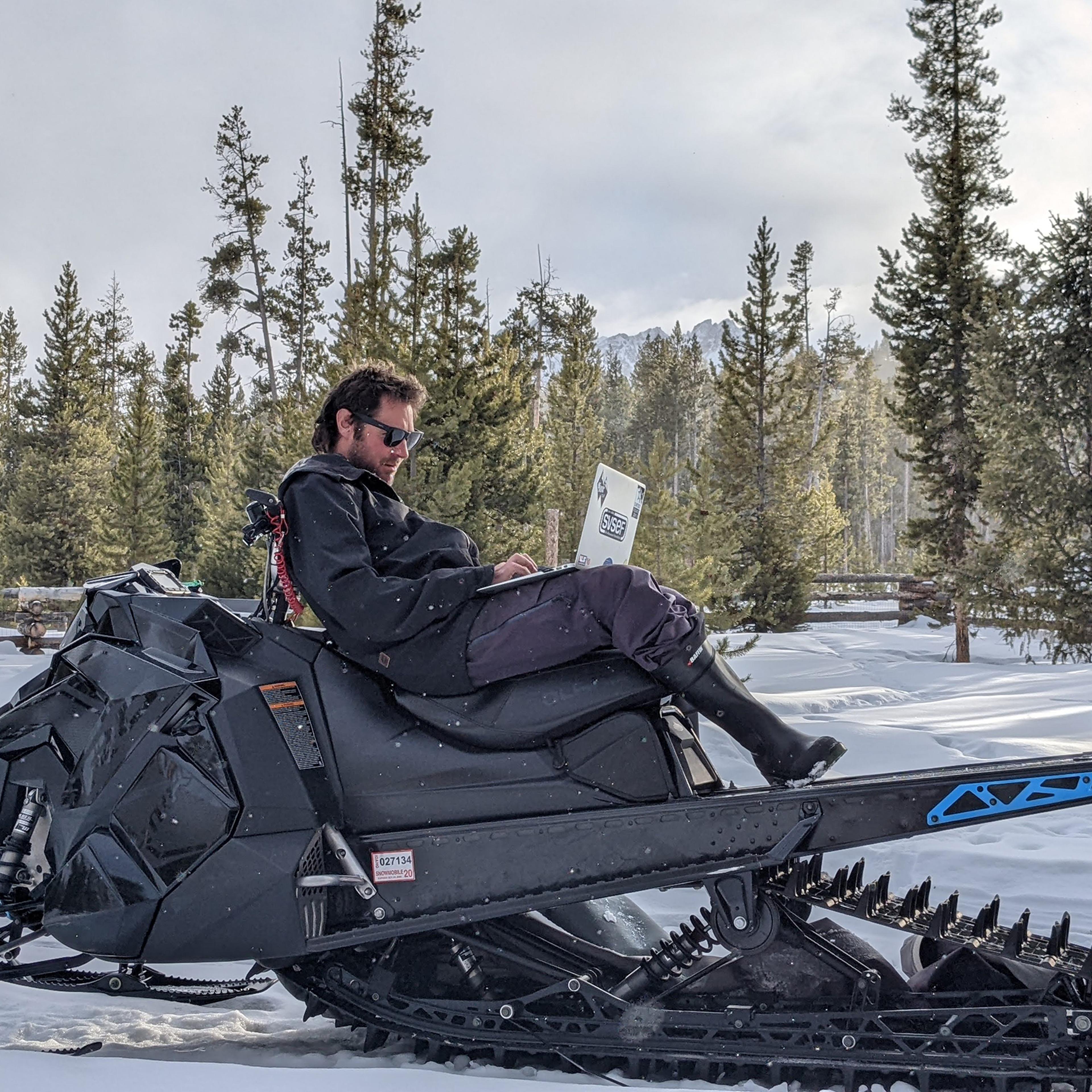 Conor Davis was able to leave his job as a ski coach thanks to his investments. He now spends his winters snowmobiling from his cabin in Stanley, ID.
