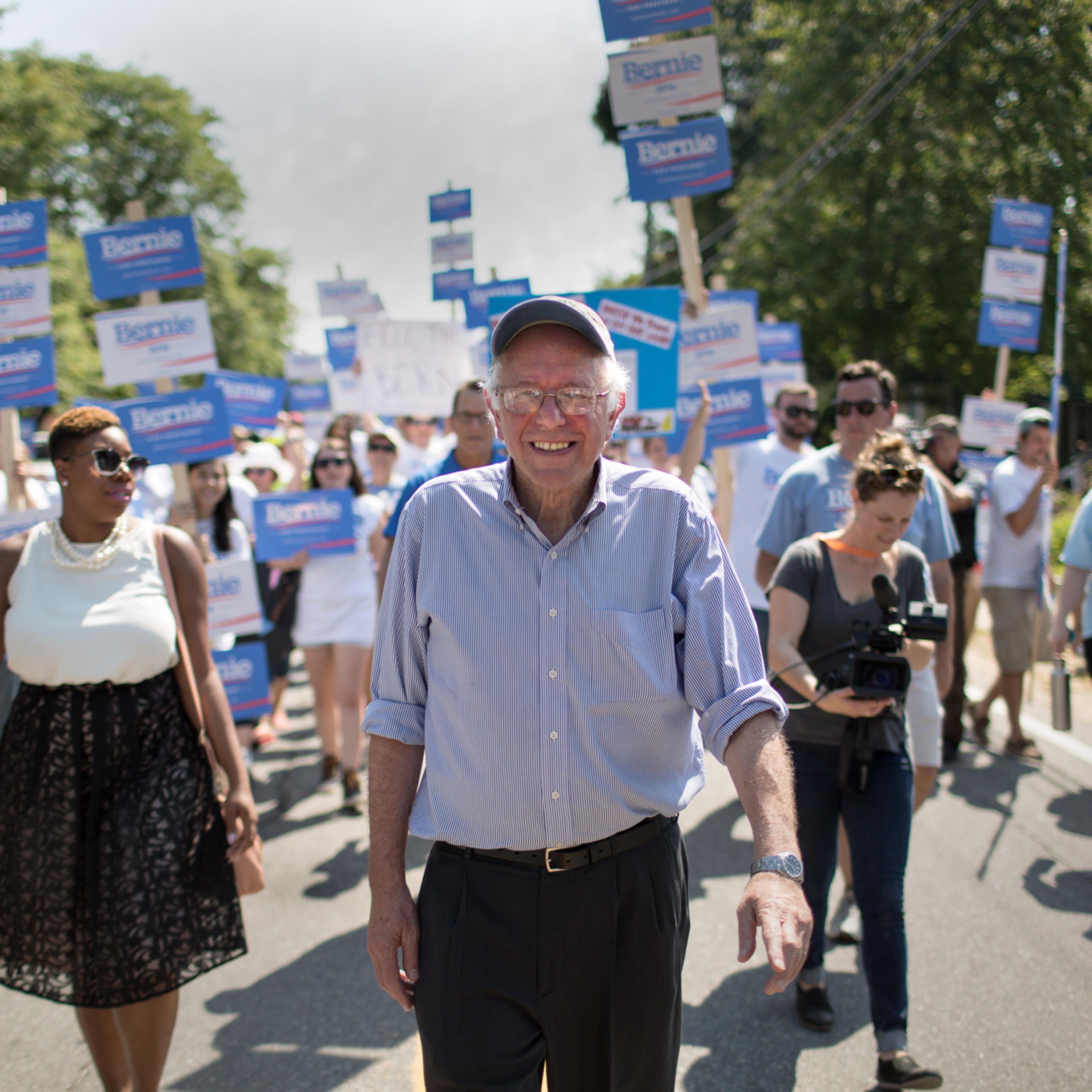Senator Bernie Sanders and his national press secretary Symone Sanders (no relation) march in the Labor Day parade in Milford, NH.