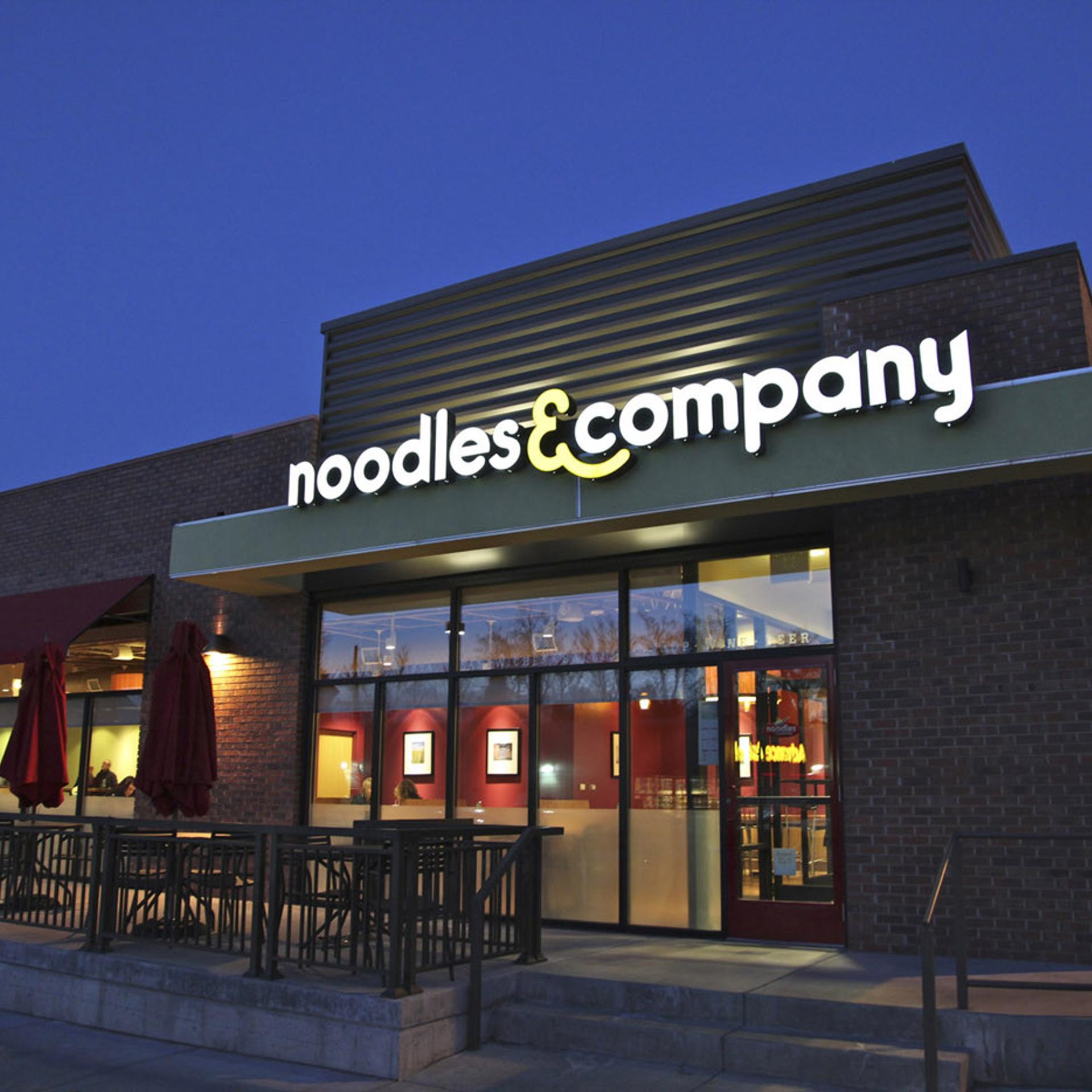 A top Noodles & Co. executive is resigning to become CEO of a hot dog purveyor.