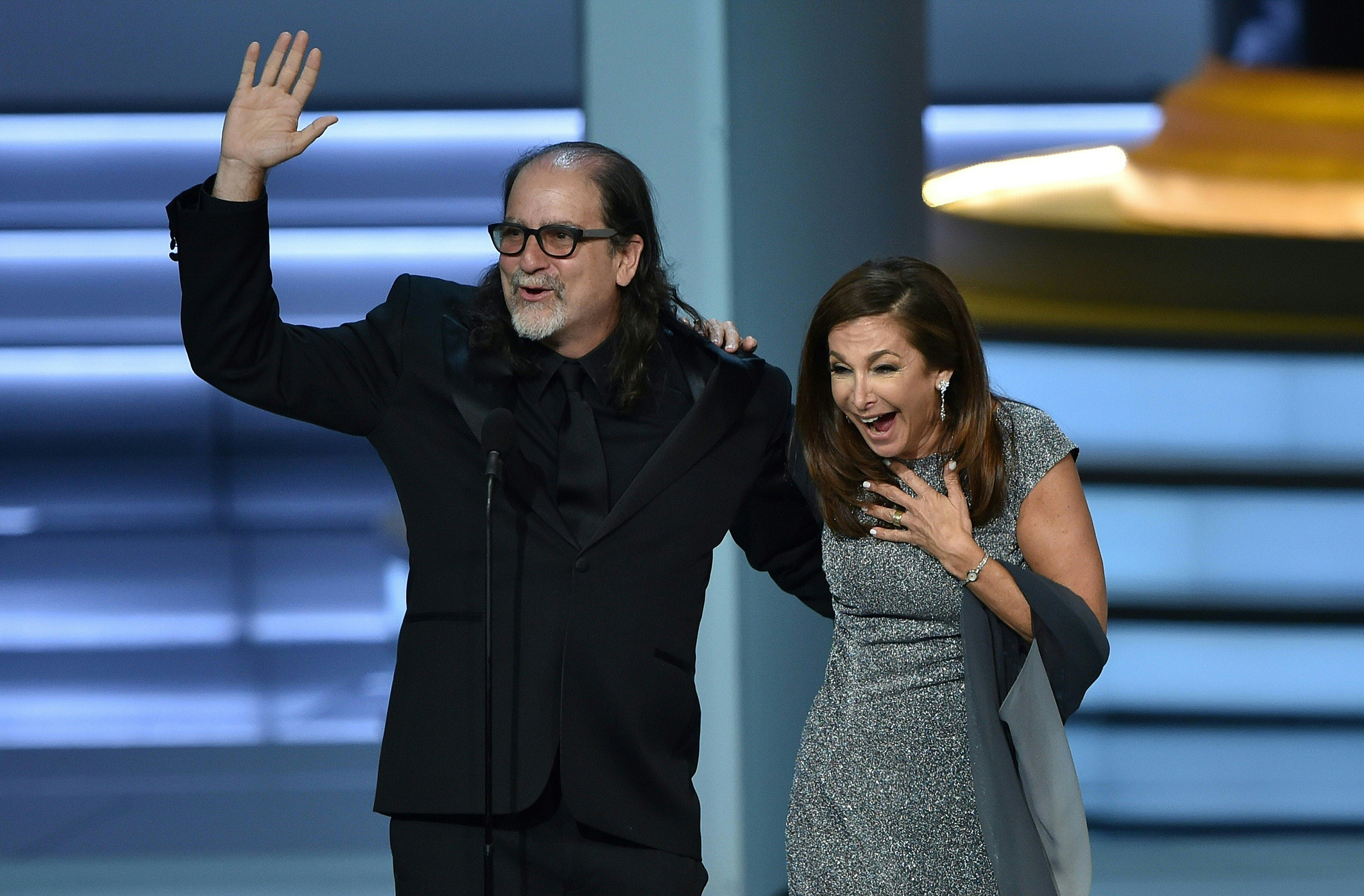 Glenn Weiss, winner of the Outstanding Directing for a Variety Special award for 'The Oscars,' waves to the audience after proposing to Jan Svendsen onstage during the 70th Emmy Awards at the Microsoft Theatre in Los Angeles on Sept. 17, 2018.