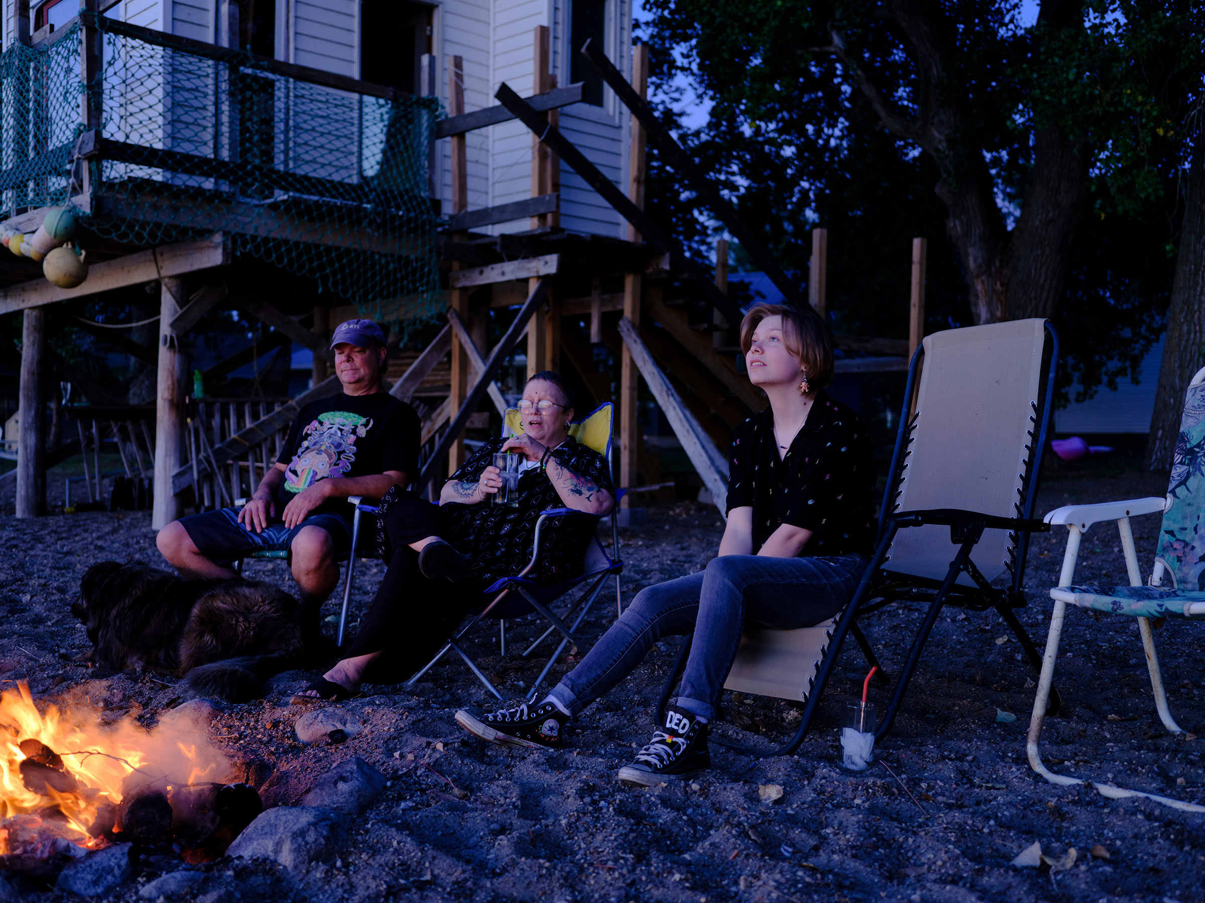 Austen sits by a bonfire with his parents in South Dakota. Austen has loved storytelling ever since he was a kid, when he and his dad would tell each other scary stories on walks, “popcorning off of each other.” Now, with dreams of being an author, he ma