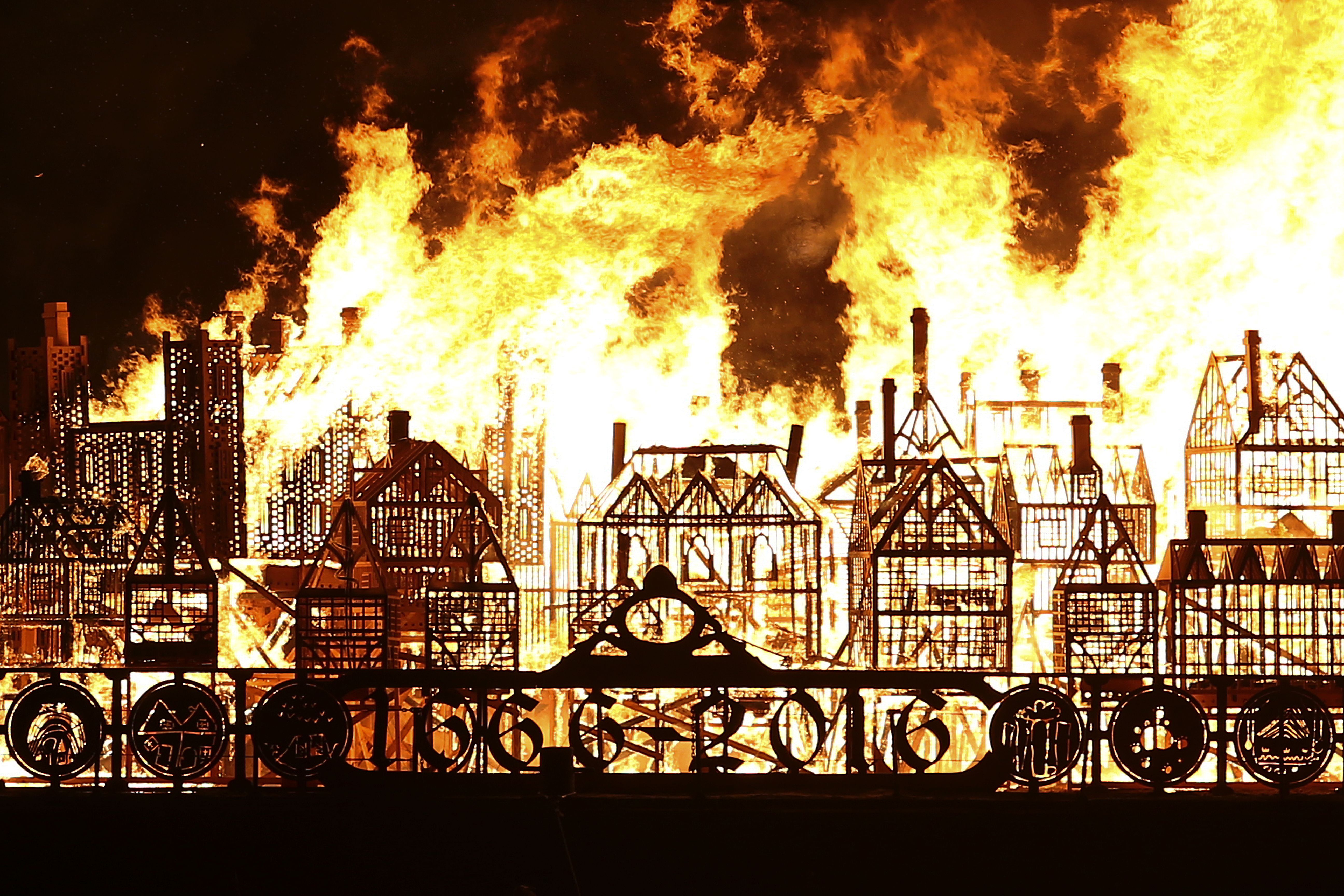 A replica of 17th-century London on a barge floating on the river Thames burns in an event to mark the 350th anniversary of the Great Fire of London, in London on September 4, 2016.