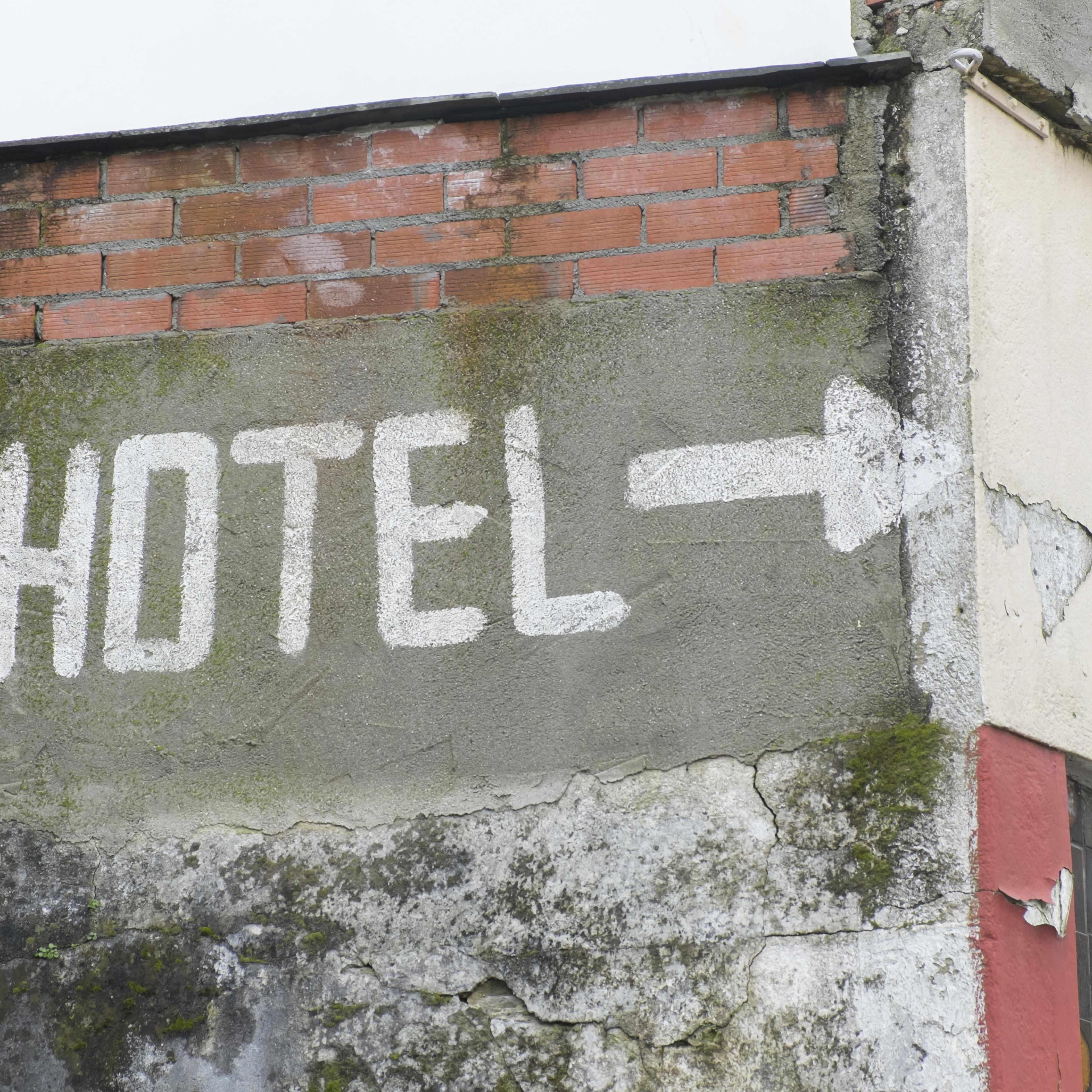Painted sign indicatiing an hotel