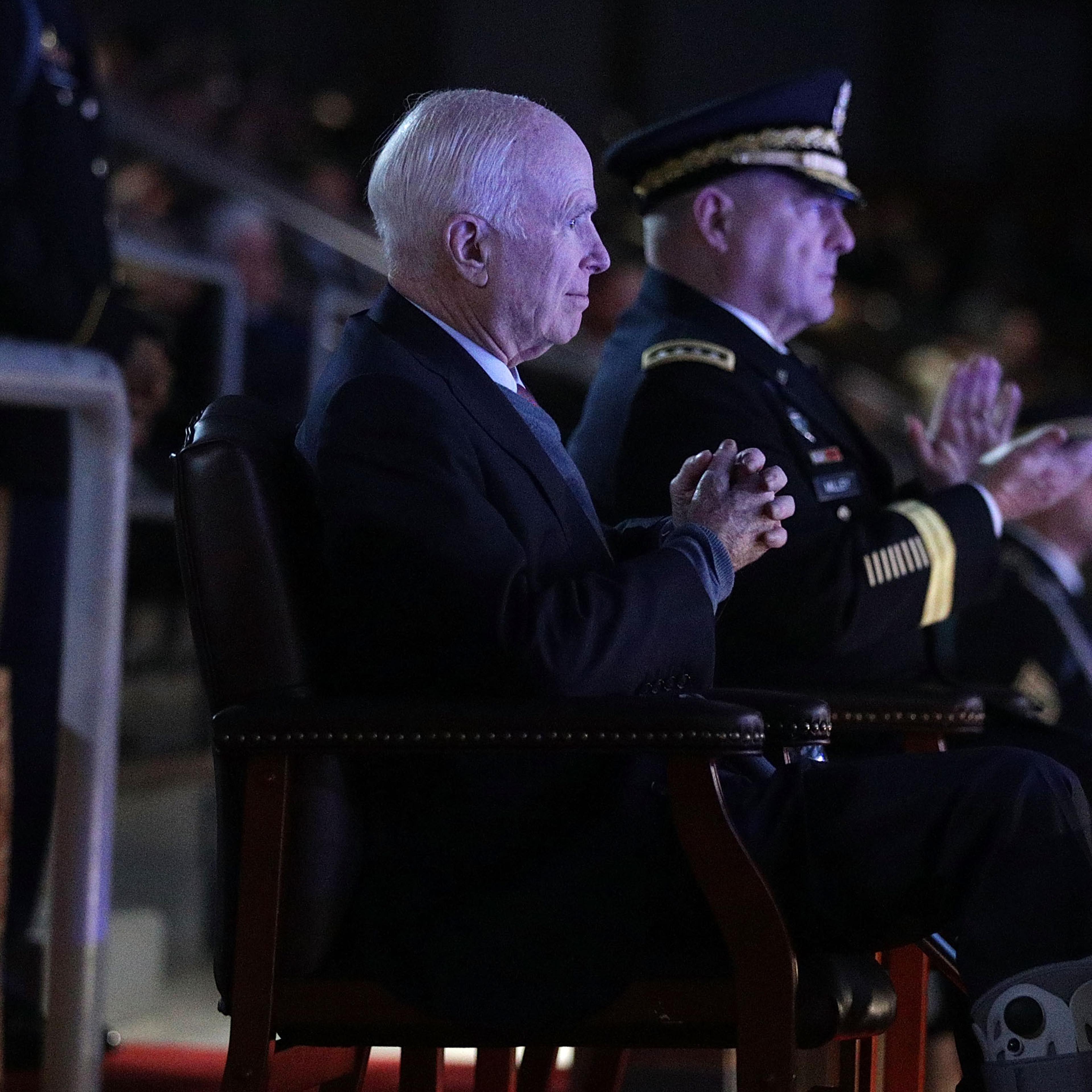 John McCain views an army performance