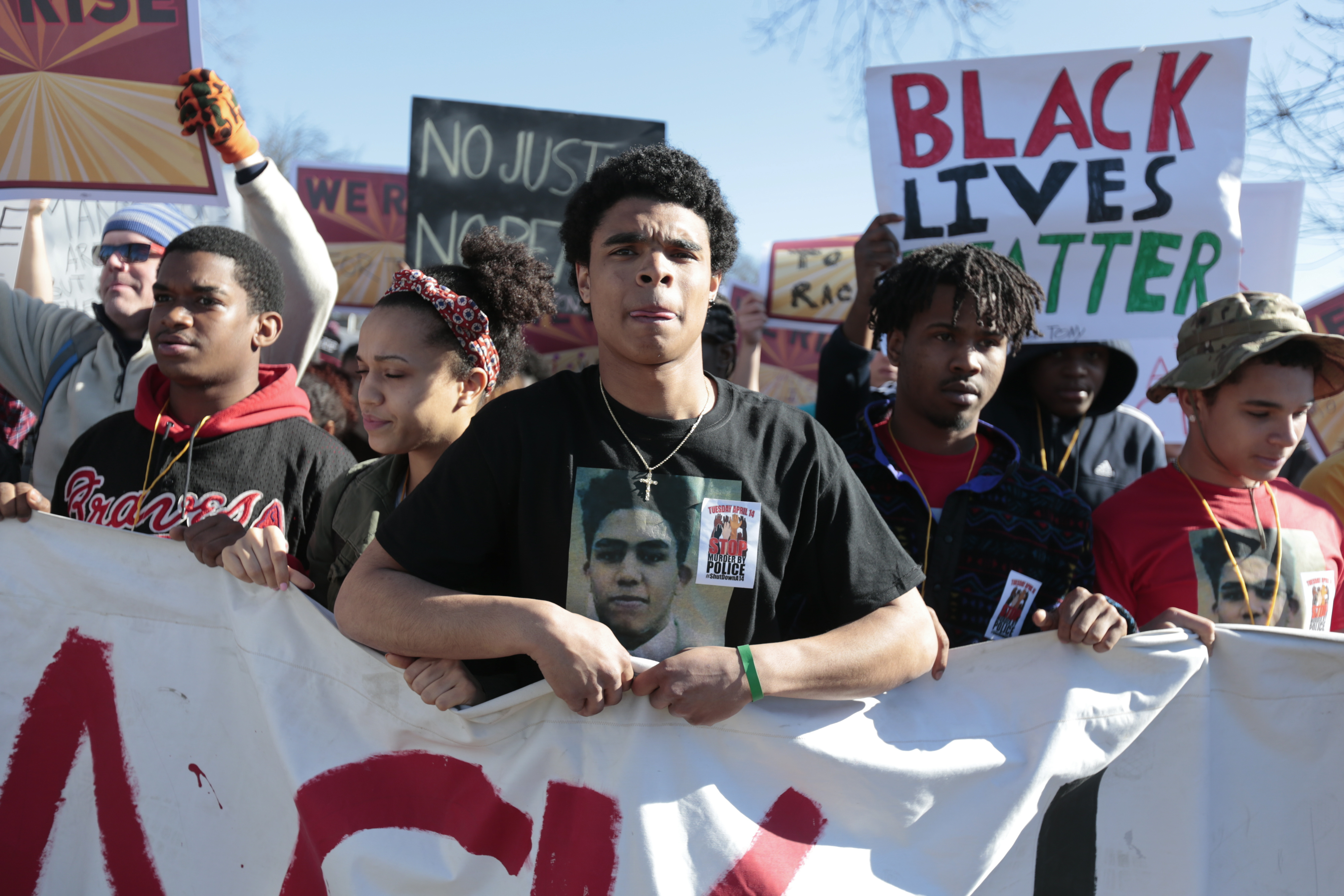 Demonstrators prepare to march in protest against the fatal police shooting of Tony Robinson in Madison, Wis. on March 11, 2015.
