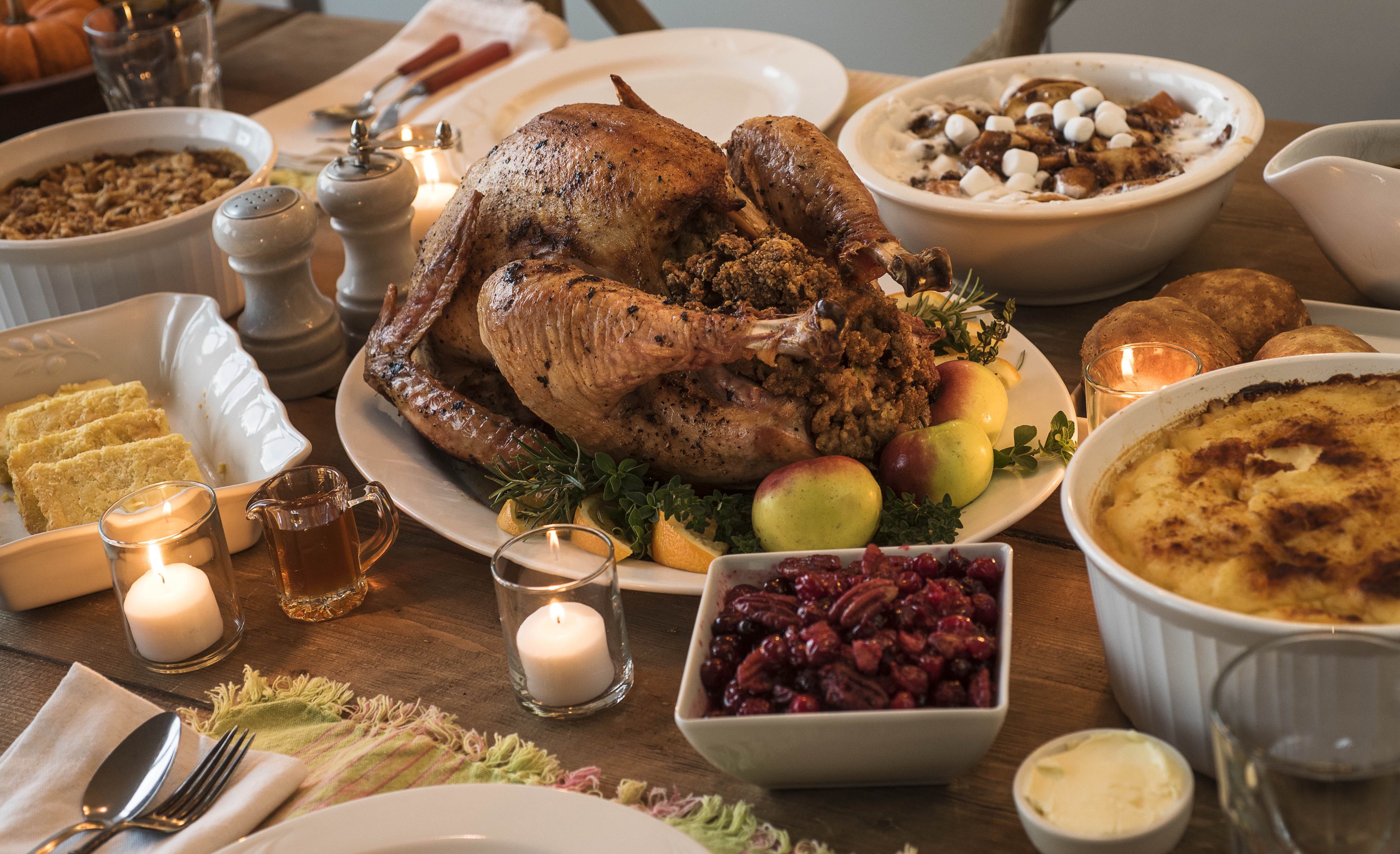 Dining table filled with thanksgiving food