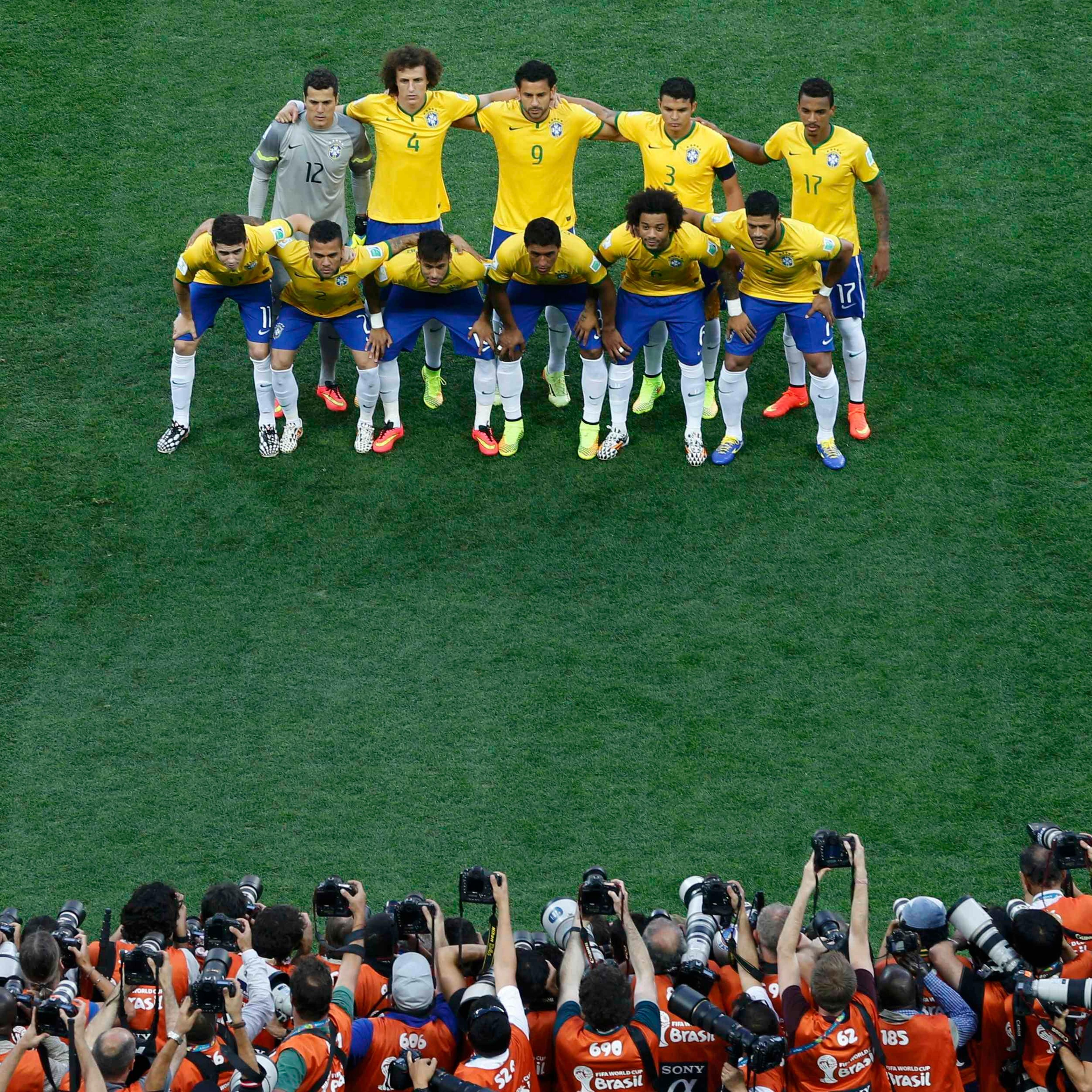 Brazil's national soccer players pose for a team photo before their 2014 World Cup opening match against Croatia at the Corinthians arena in Sao Paulo