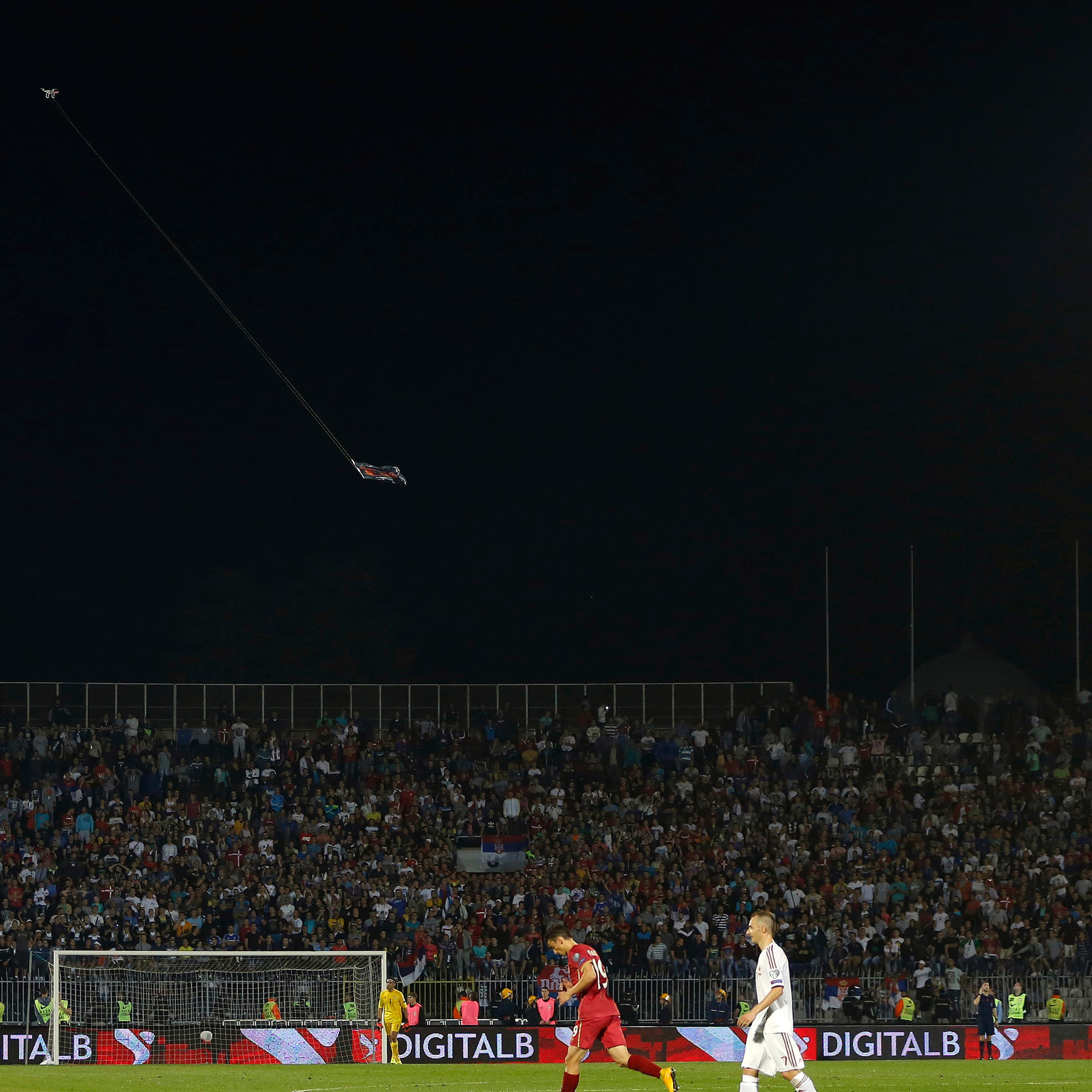 Mini drone carrying flag depicting so-called Greater Albania is flown over the pitch during their Euro 2016 Group I qualifying soccer match against Albania at the FK Partizan stadium in Belgrade