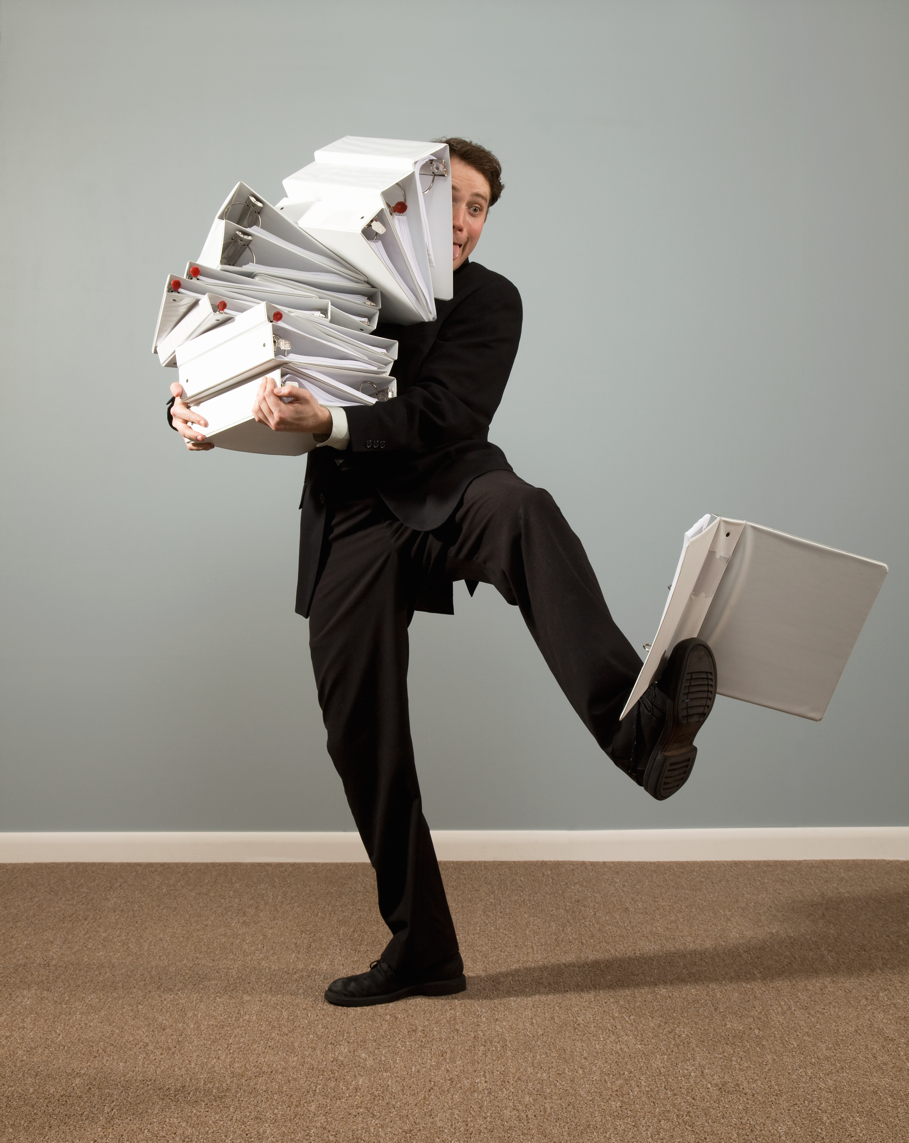 man-holding-binders