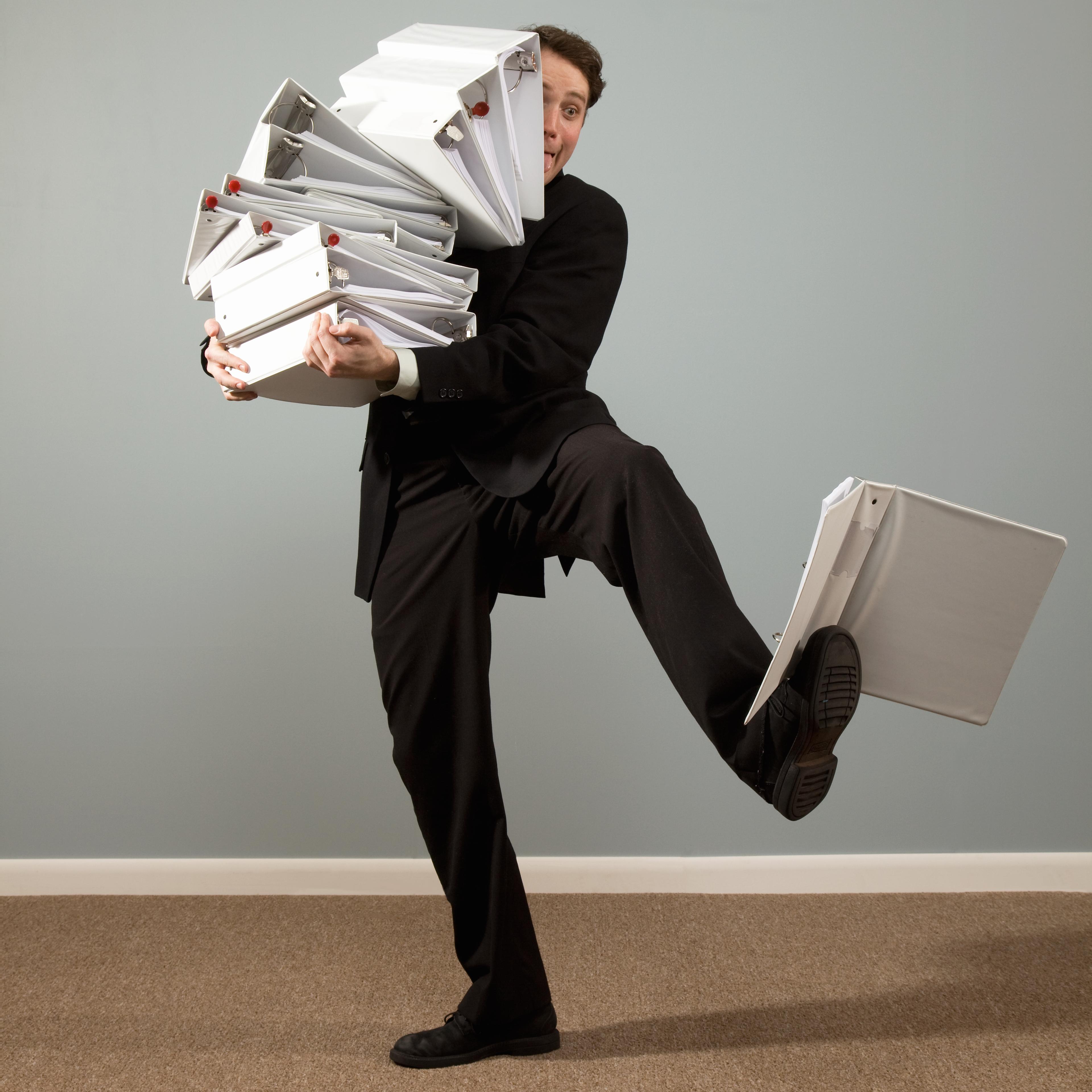 man-holding-binders