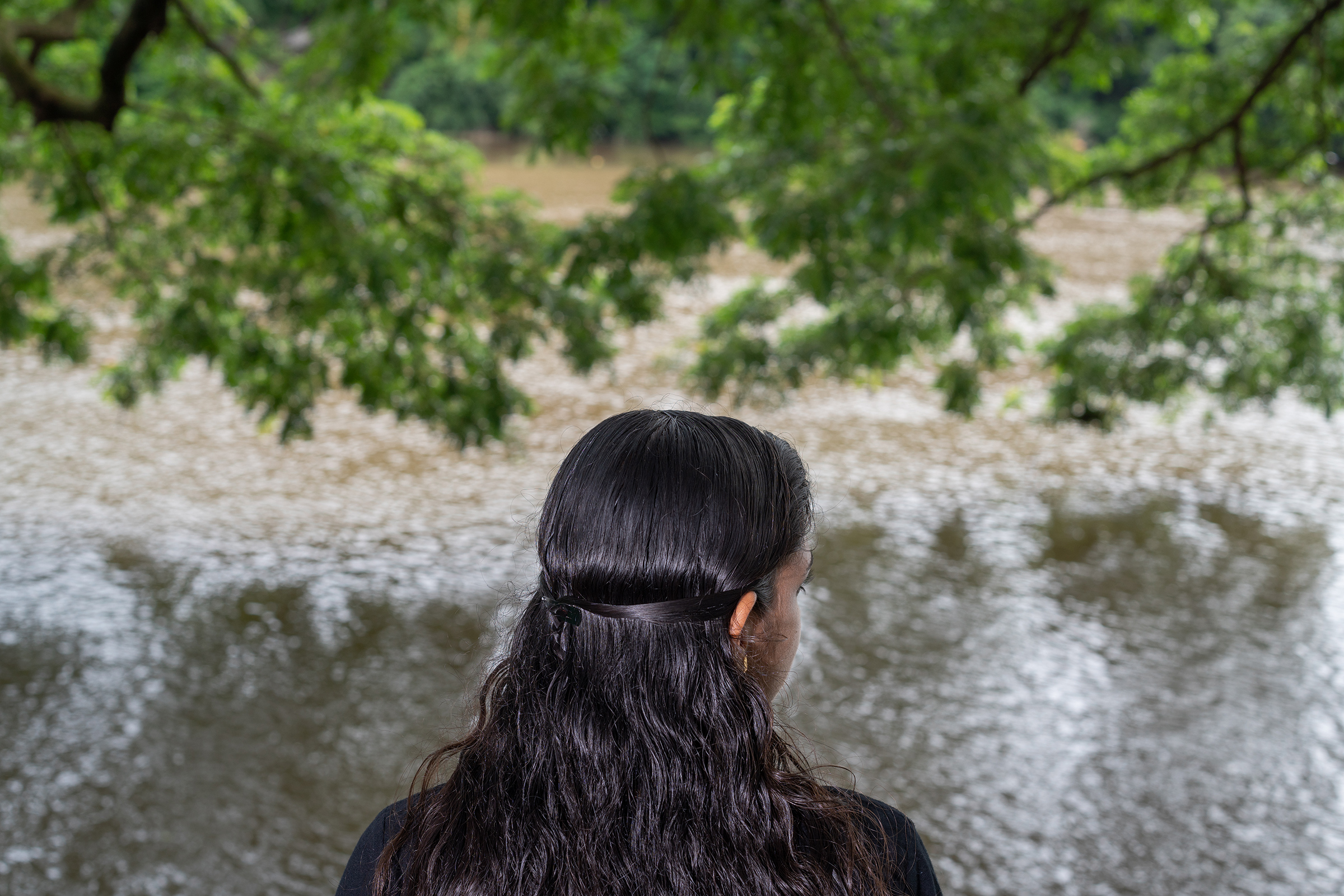 Meenakshi Sajeesh was forced to visit dubious clinics that claim to cure homosexuality after she told her parents she was a lesbian. Sajeesh is pictured overlooking the Periyar River in Aluva town, Kochi, on June 18