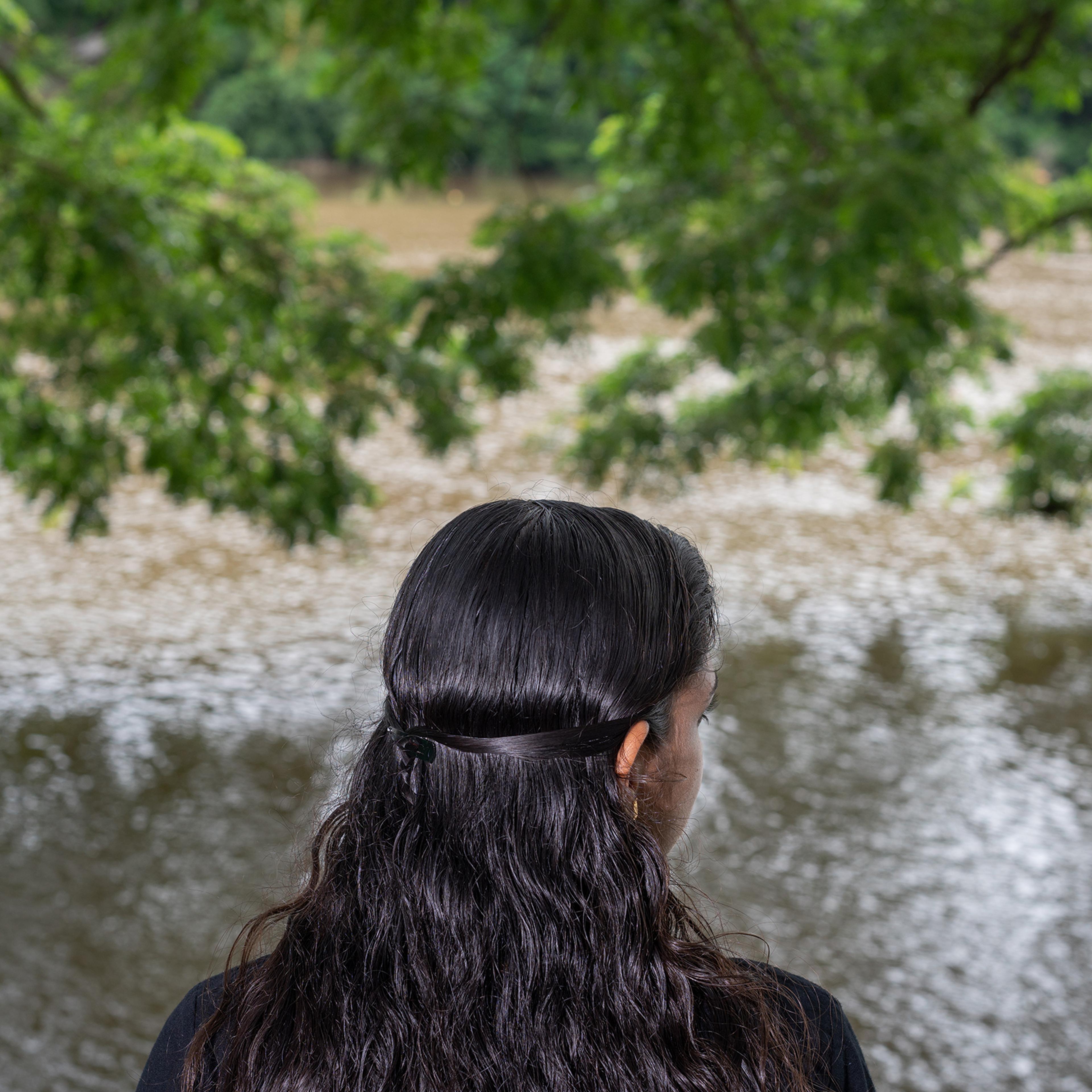 Meenakshi Sajeesh was forced to visit dubious clinics that claim to cure homosexuality after she told her parents she was a lesbian. Sajeesh is pictured overlooking the Periyar River in Aluva town, Kochi, on June 18