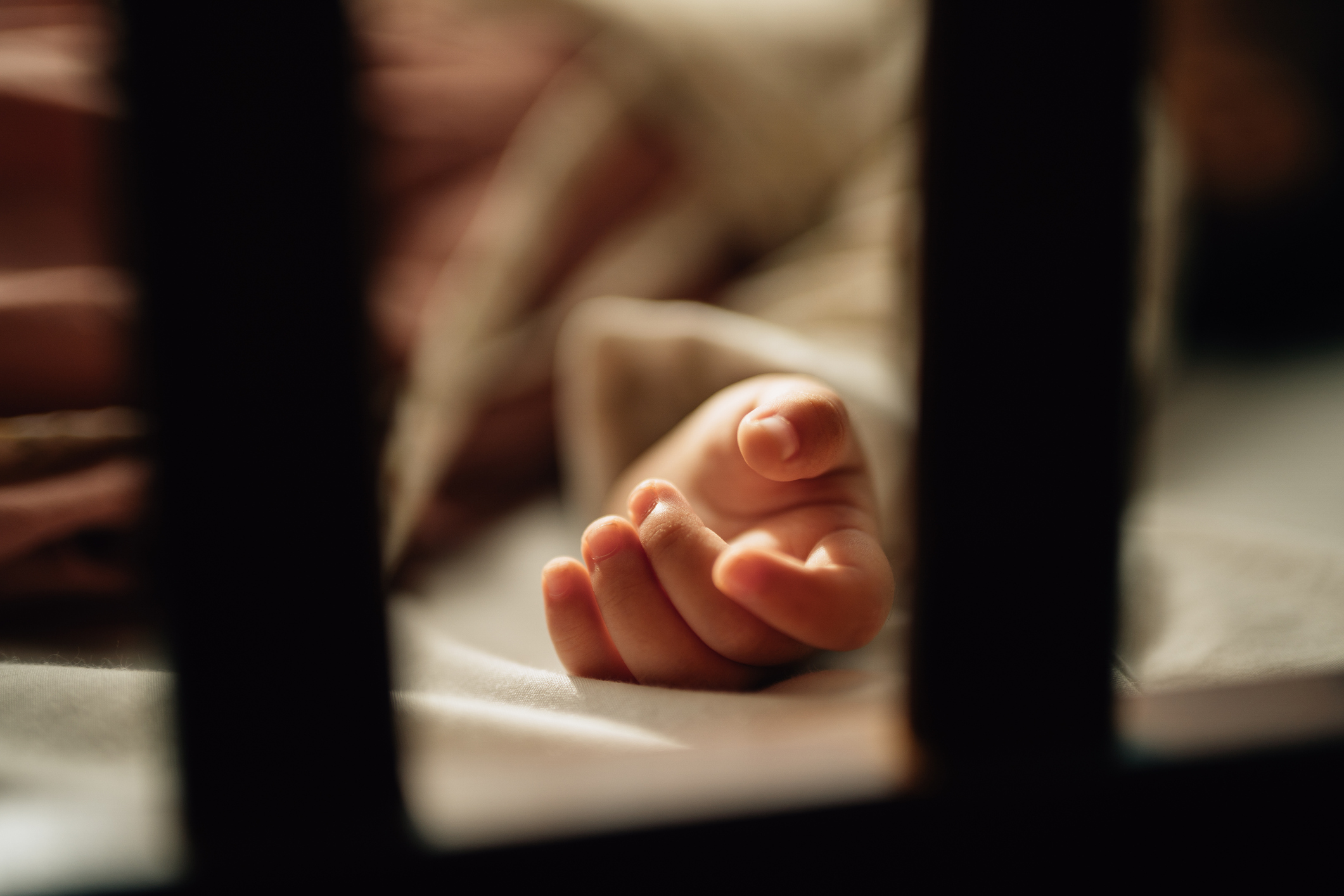 Little girl sleeping on bed