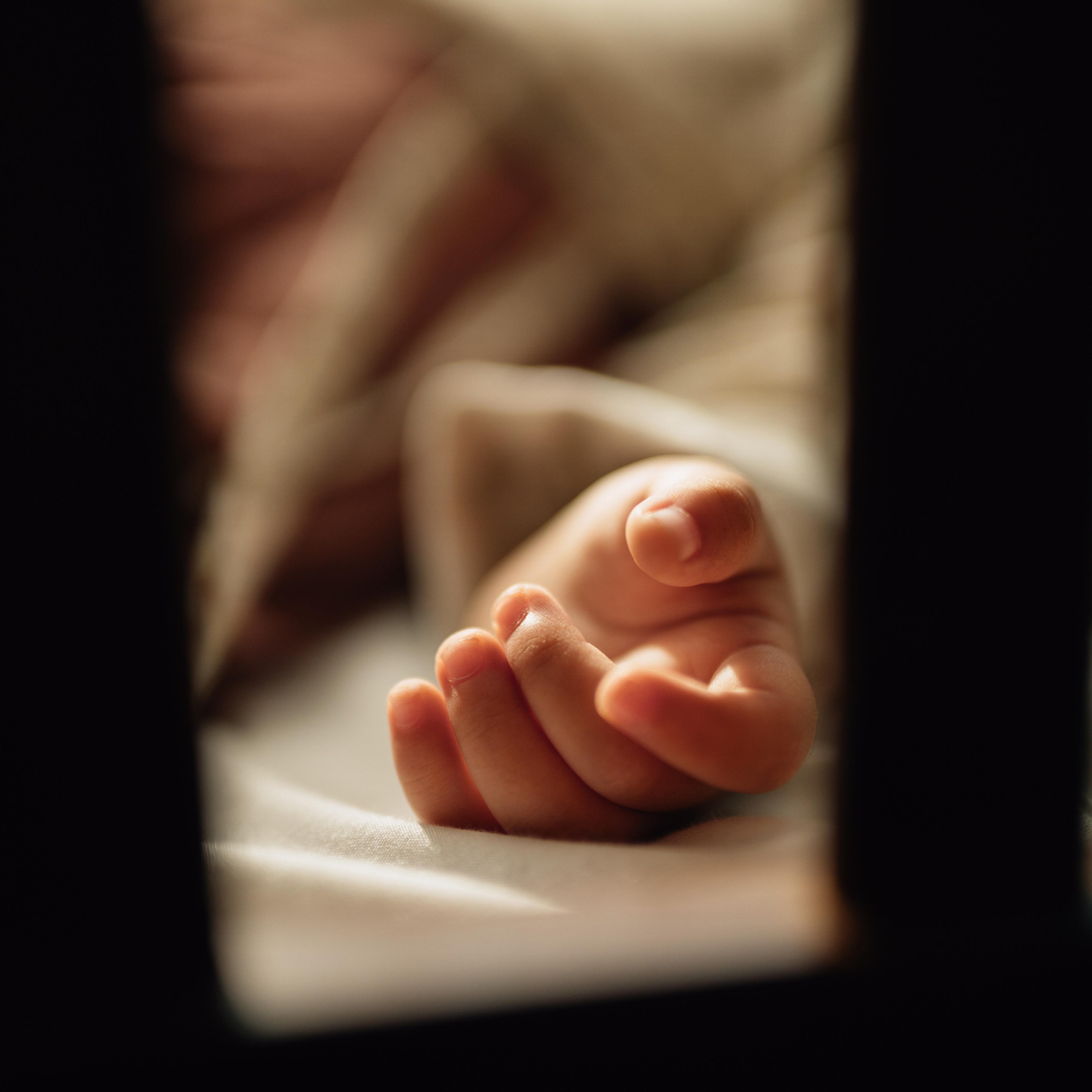 Little girl sleeping on bed