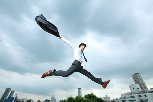 businessman-jumping-city