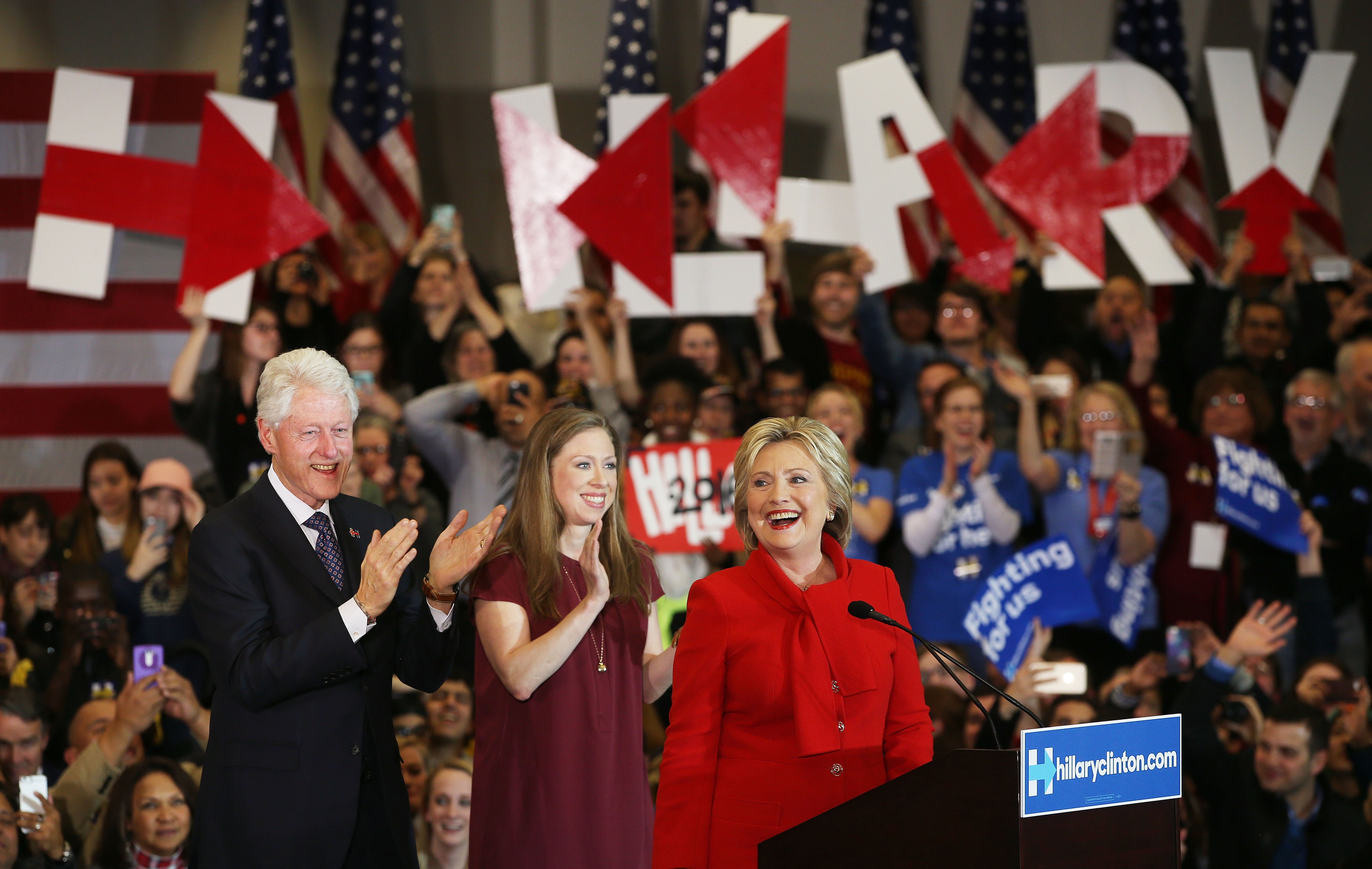 Democratic presidential candidate Hillary Clinton speaks to supporters as former U.S. president Bill Clinton and daughter Chelsea Clinton look on during her caucus night event in the Olmsted Center at Drake University, Des Moines, Iowa, Feb. 1, 2016.