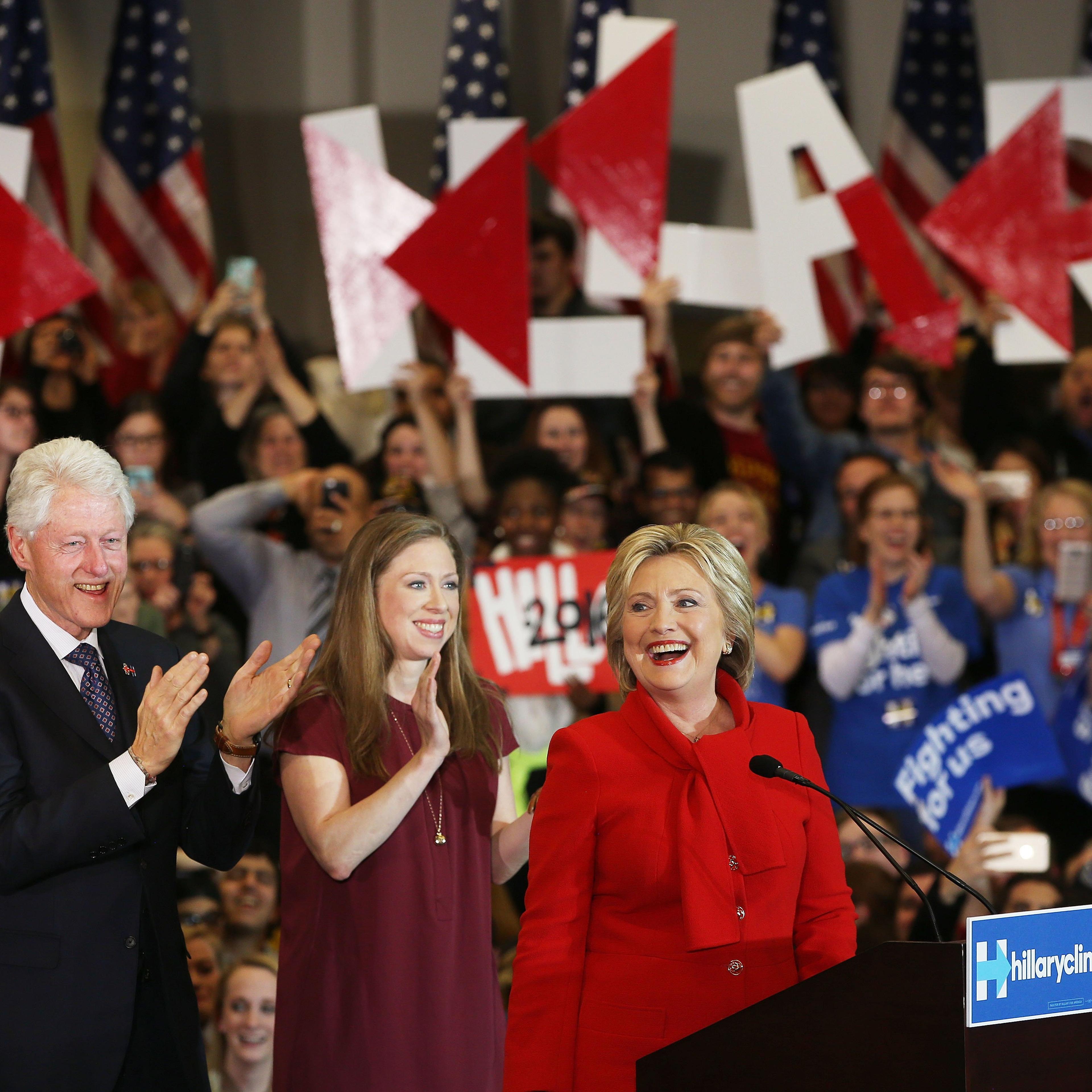 Democratic presidential candidate Hillary Clinton speaks to supporters as former U.S. president Bill Clinton and daughter Chelsea Clinton look on during her caucus night event in the Olmsted Center at Drake University, Des Moines, Iowa, Feb. 1, 2016.