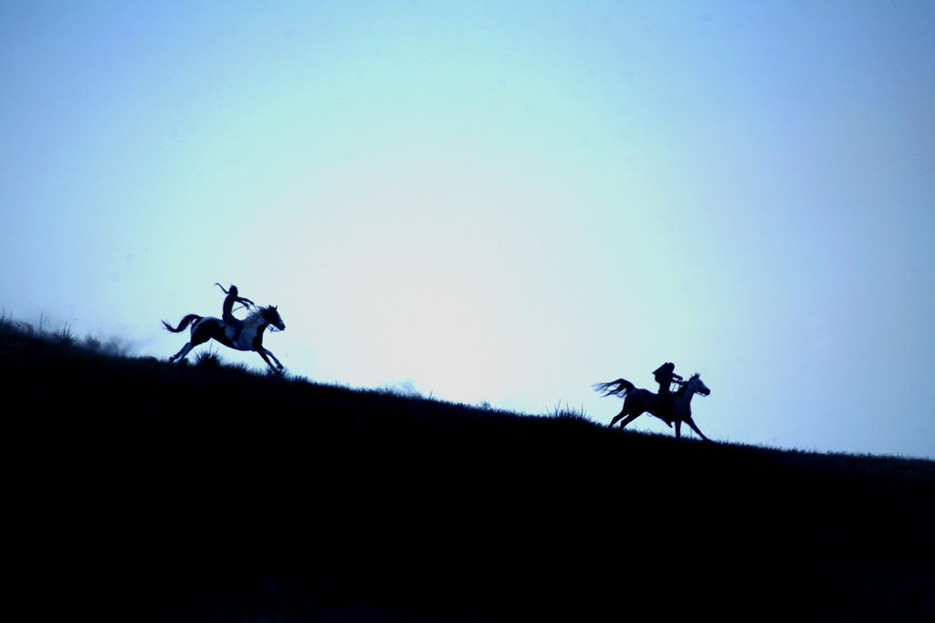 A traditional Indian horse race called the "Suicide run," a dangerous, breakneck race for young Lakota, men and women alike, through mixed terrain, held near Manderson to commemorate the Anniversary of the Little Big Horn and the defeat of General Custer.  Games and races like this are bringing the young Lakota back to their Warrior roots.