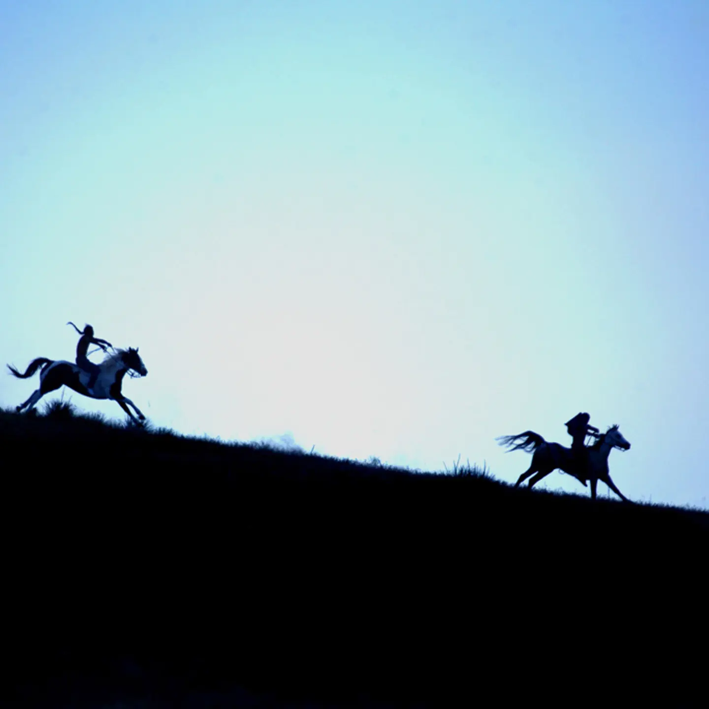 A traditional Indian horse race called the "Suicide run," a dangerous, breakneck race for young Lakota, men and women alike, through mixed terrain, held near Manderson to commemorate the Anniversary of the Little Big Horn and the defeat of General Custer. Games and races like this are bringing the young Lakota back to their Warrior roots.