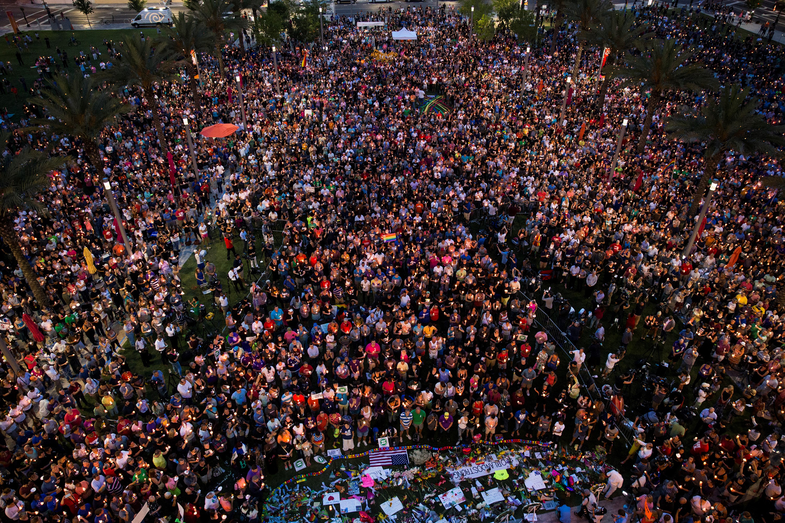 Thousands gather at the Dr. Phillips Center for the Performing Arts to pay their respects for those lost in the Pulse nightclub shooting in Orlando on June 13, 2016.