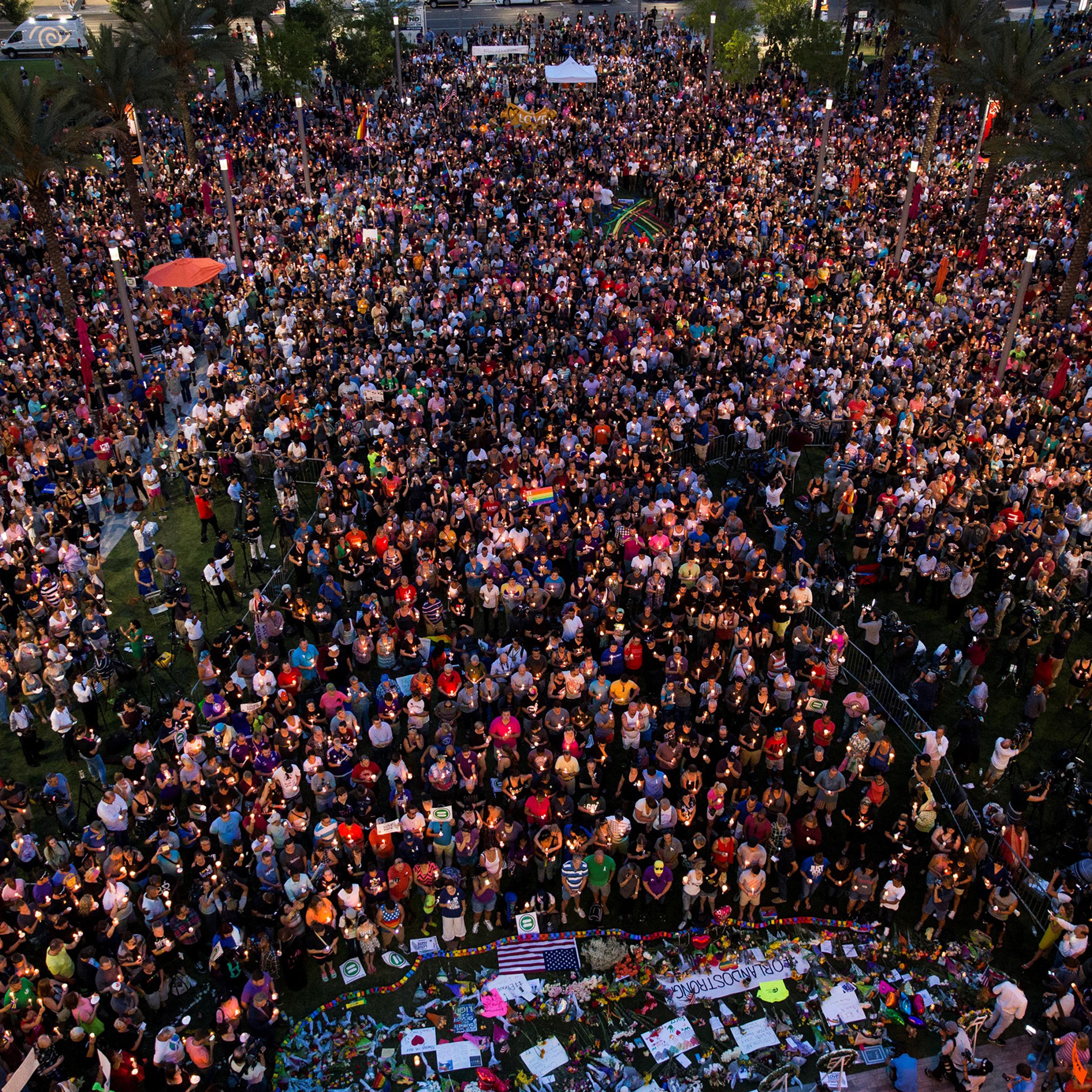 Thousands gather at the Dr. Phillips Center for the Performing Arts to pay their respects for those lost in the Pulse nightclub shooting in Orlando on June 13, 2016.