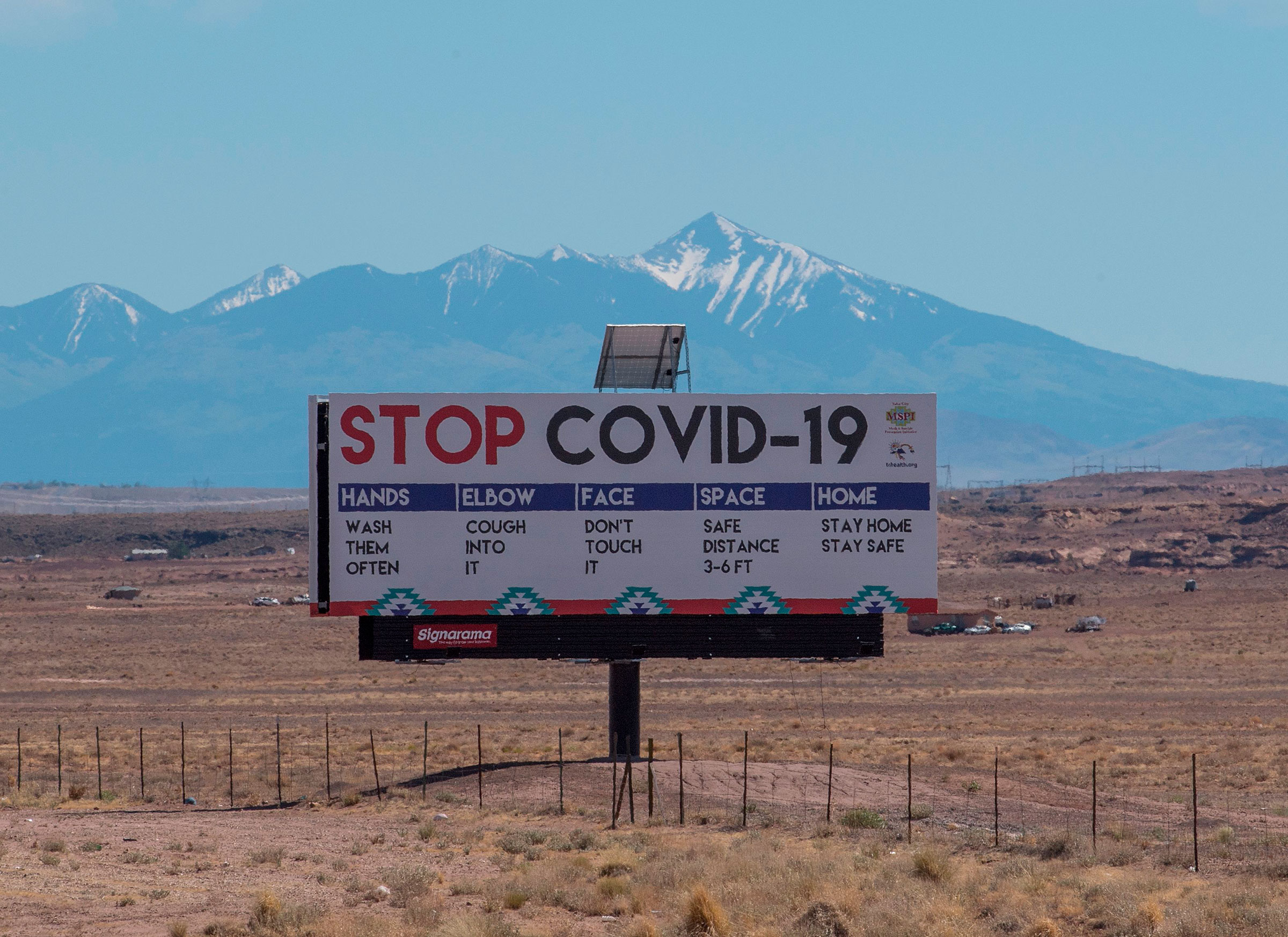 A sign warns against the Covid-19 virus near the Navajo Indian nation town of Tuba City, Arizona on May 24, 2020.