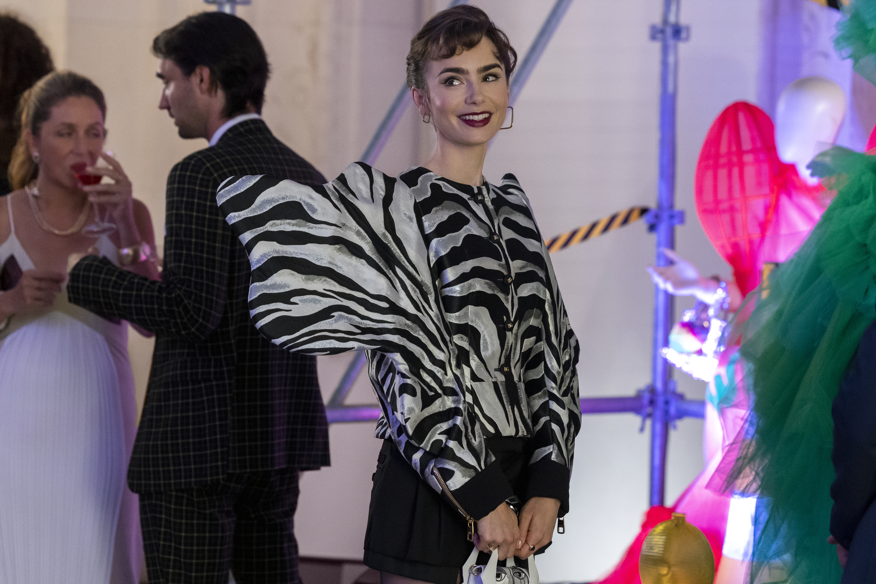 Emily in Paris. Lily Collins as Emily in episode 302 of Emily in Paris. Cr. Marie Etchegoyen/Netflix © 2022