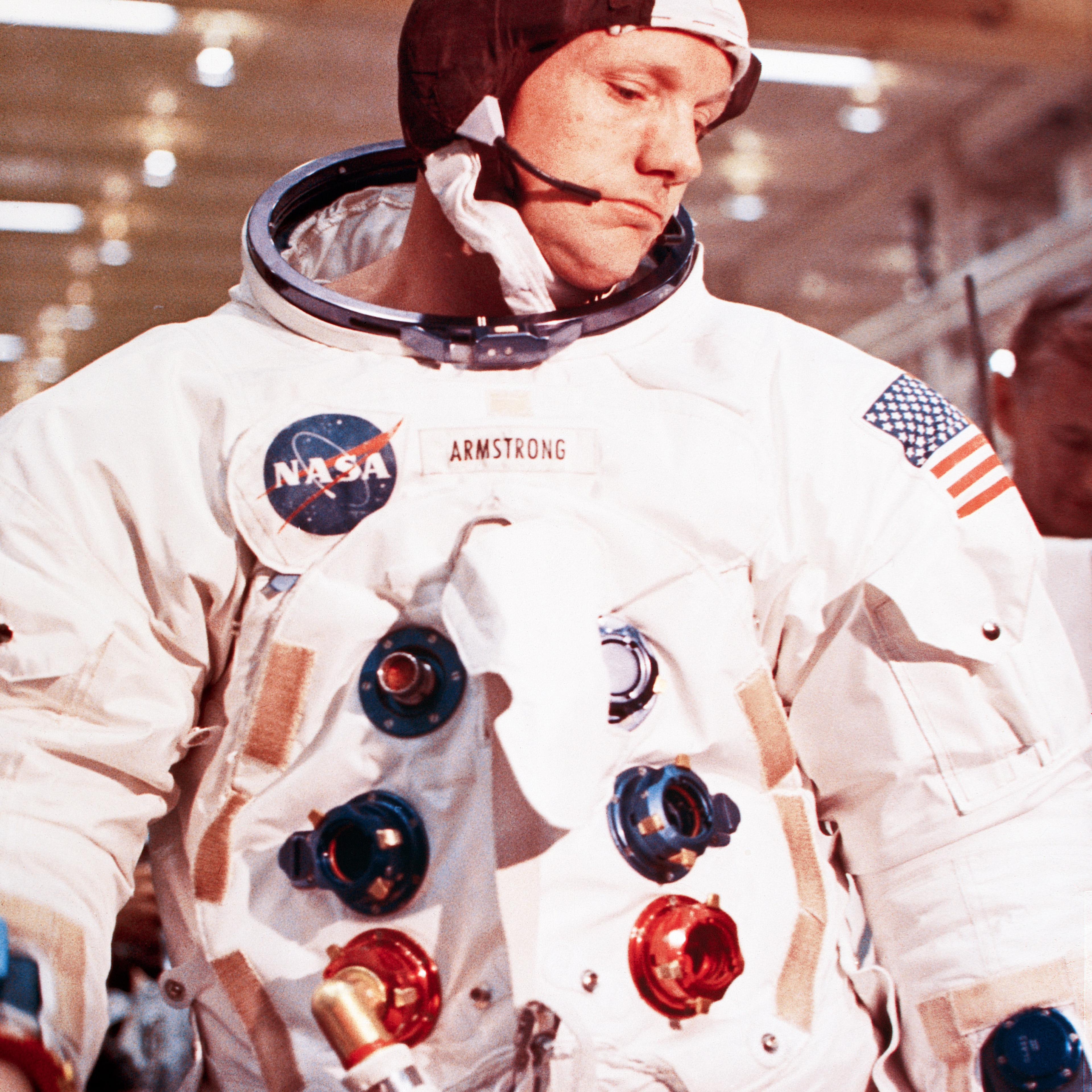 Apollo 11 mission commander Neil Armstrong puts on and checks out each element of his spacesuit before lift-off on July 20, 1969.