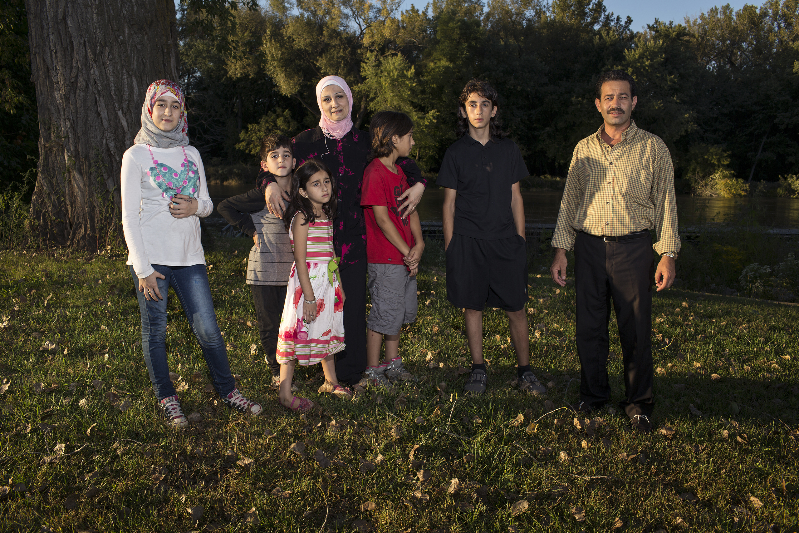 Ghazweh and Abdul Fattah at a park in Des Moines in 2016 with their children, from left to right: Sedra, Mutaz, Hala, Haidar and Nazeer. That year, the Tameems became the first Syrian refugee family to be resettled in Iowa. In the four decades of the U.S