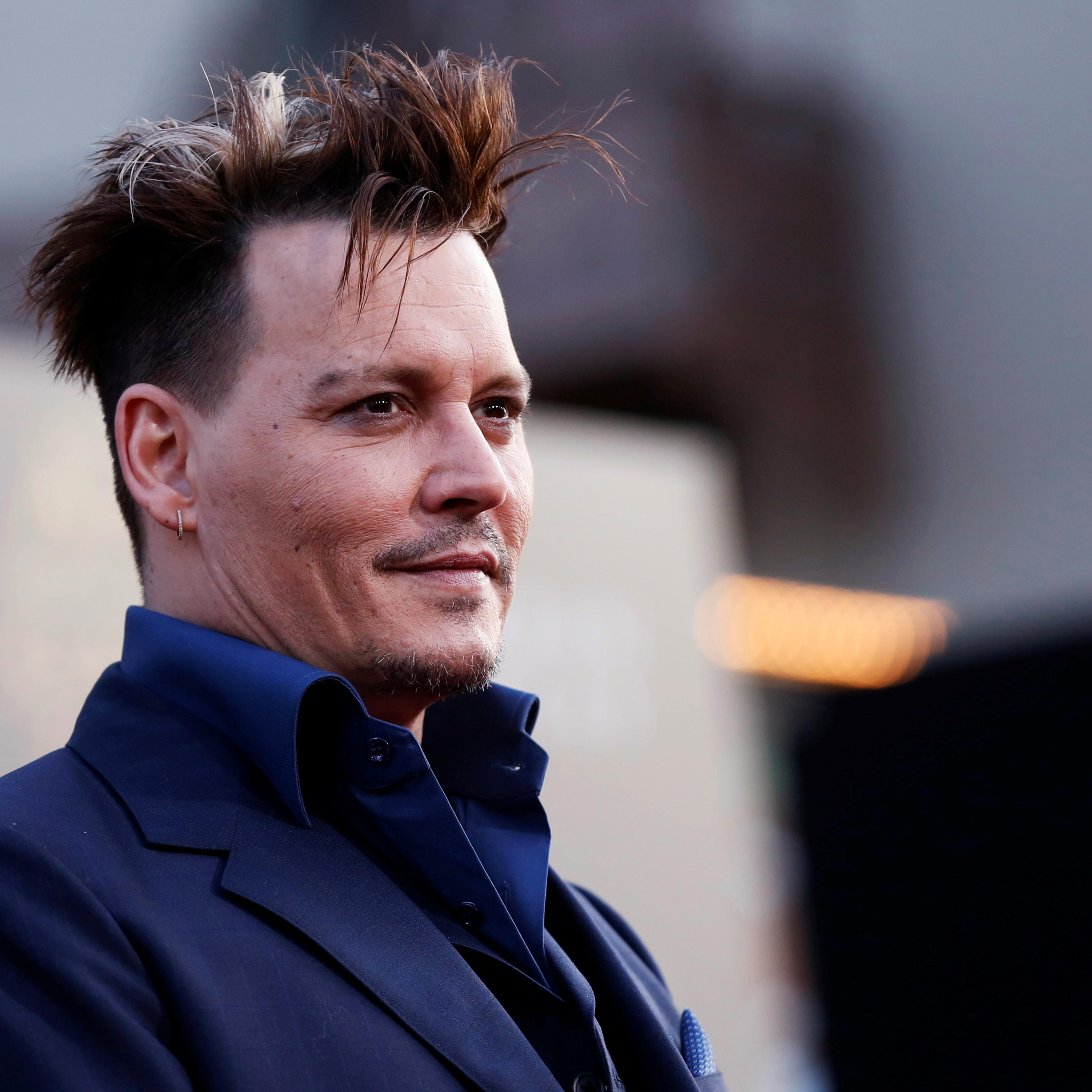 Cast member Depp poses at the premiere of "Alice Through the Looking Glass" at El Capitan theatre in Hollywood
