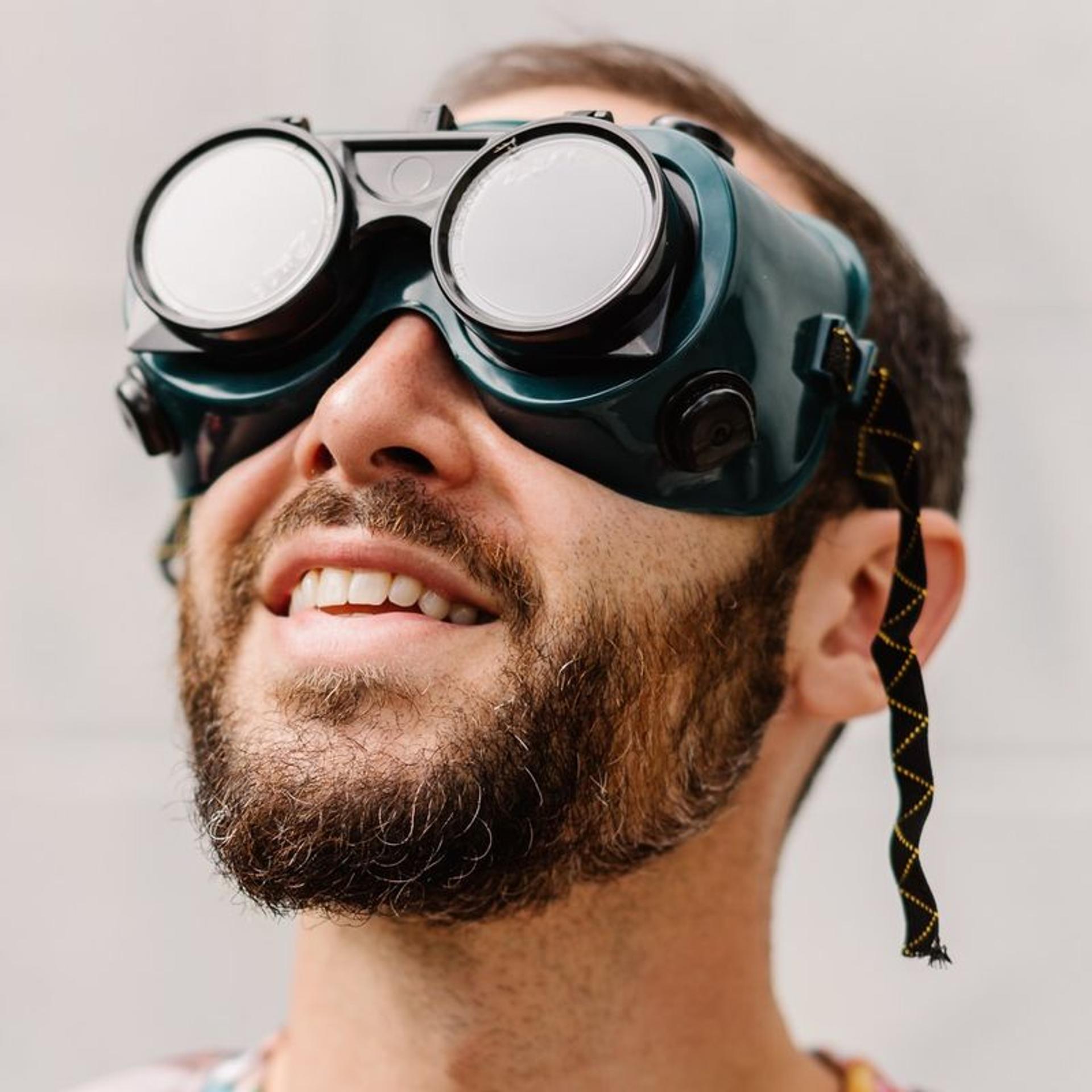 Aza Raskin, the co-founder of the Earth Species Project and the Center for Humane Technology, wearing goggles from the machine shop at the art residency Stochastic, where he lives. 'The goggles represent the lens through which we see the world, and the hope we can take off our human glasses to see through the minds of other beings,' he says.