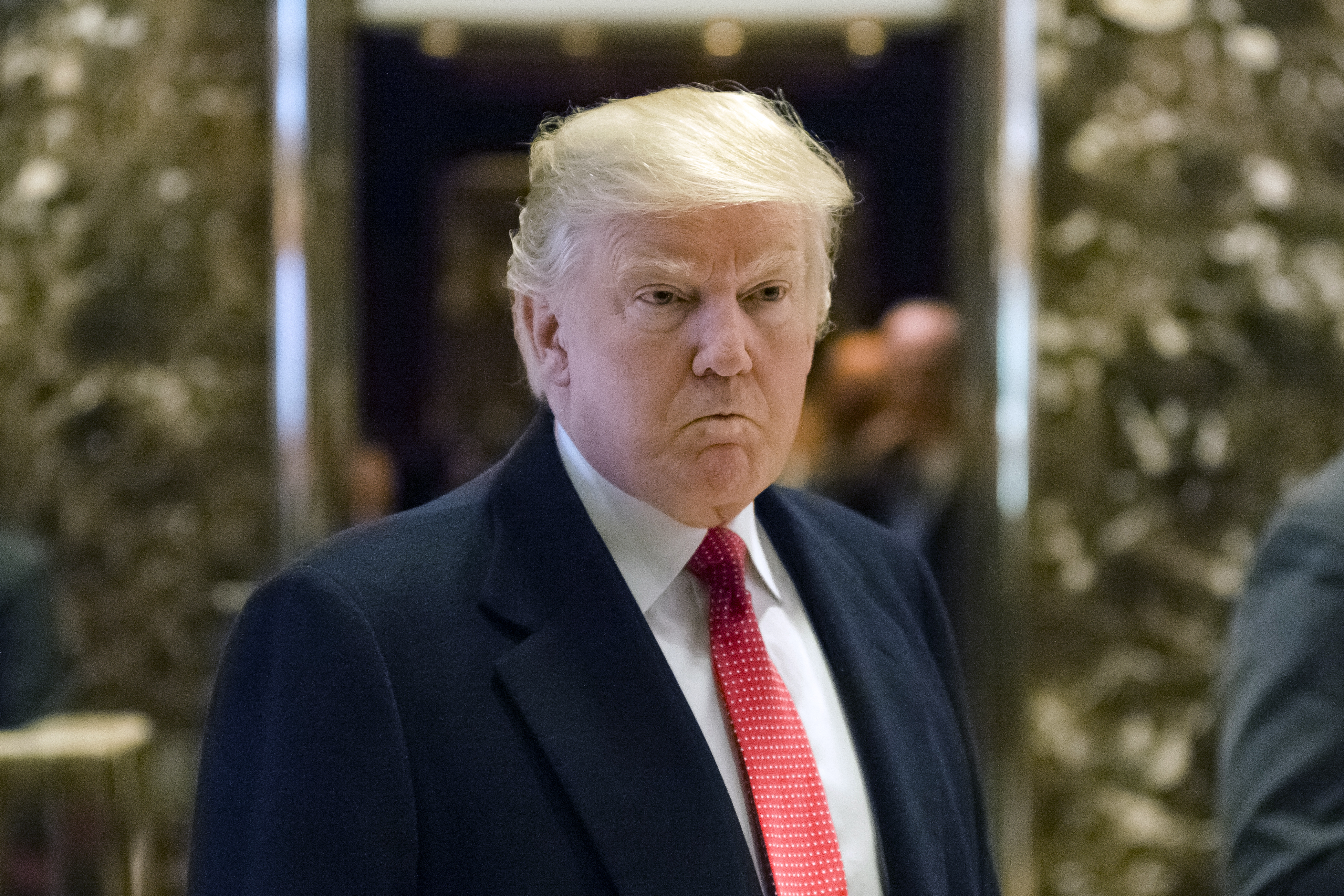 U.S. President-elect Donald Trump speaks to members of the media in the lobby at Trump Tower in New York, U.S., on Tuesday, Dec. 6, 2016.