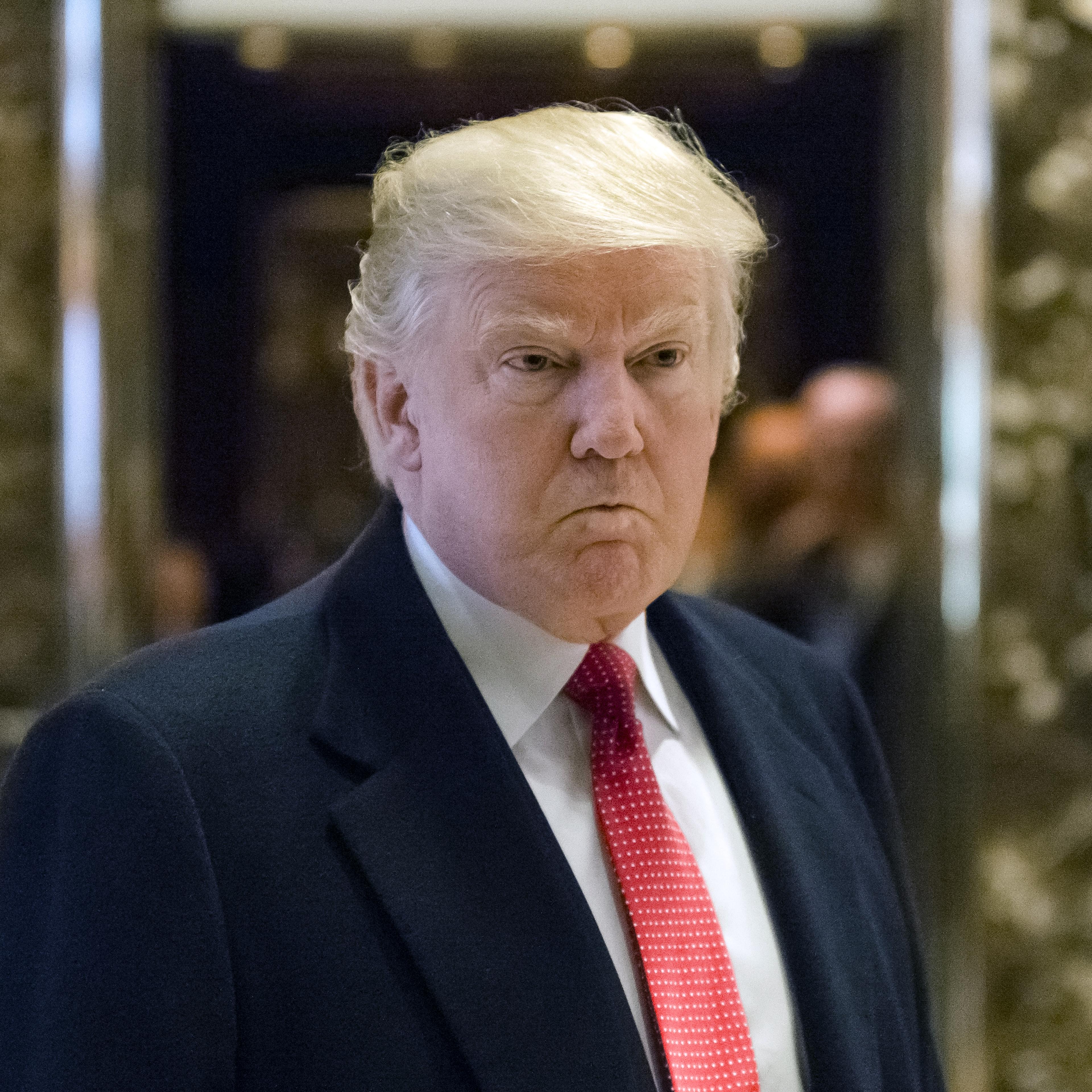 U.S. President-elect Donald Trump speaks to members of the media in the lobby at Trump Tower in New York, U.S., on Tuesday, Dec. 6, 2016.