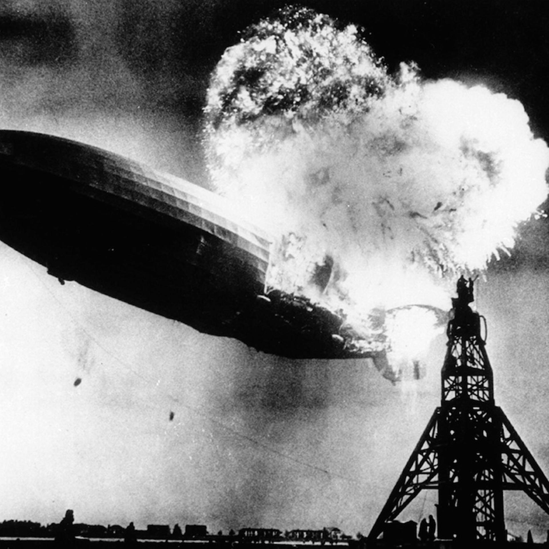 The Hindenburg, a large German commercial passenger-carrying rigid airship, destroyed by fire.