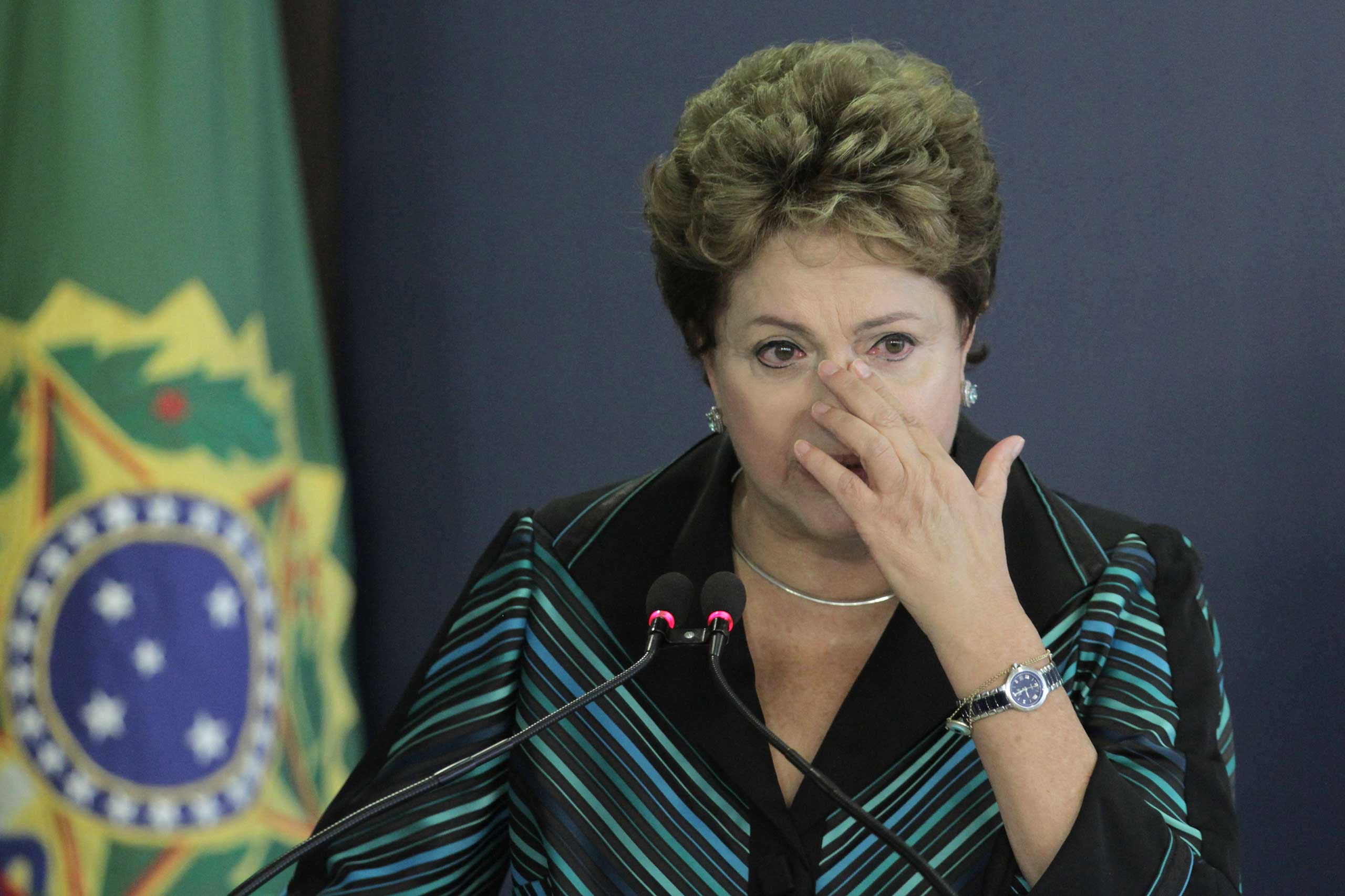 Brazil's President Dilma Rousseff cries during a speech at the launching ceremony of the National Truth Commission Report, at the Planalto Presidential Palace, in Brasilia, Brazil, Dec. 10, 2014.