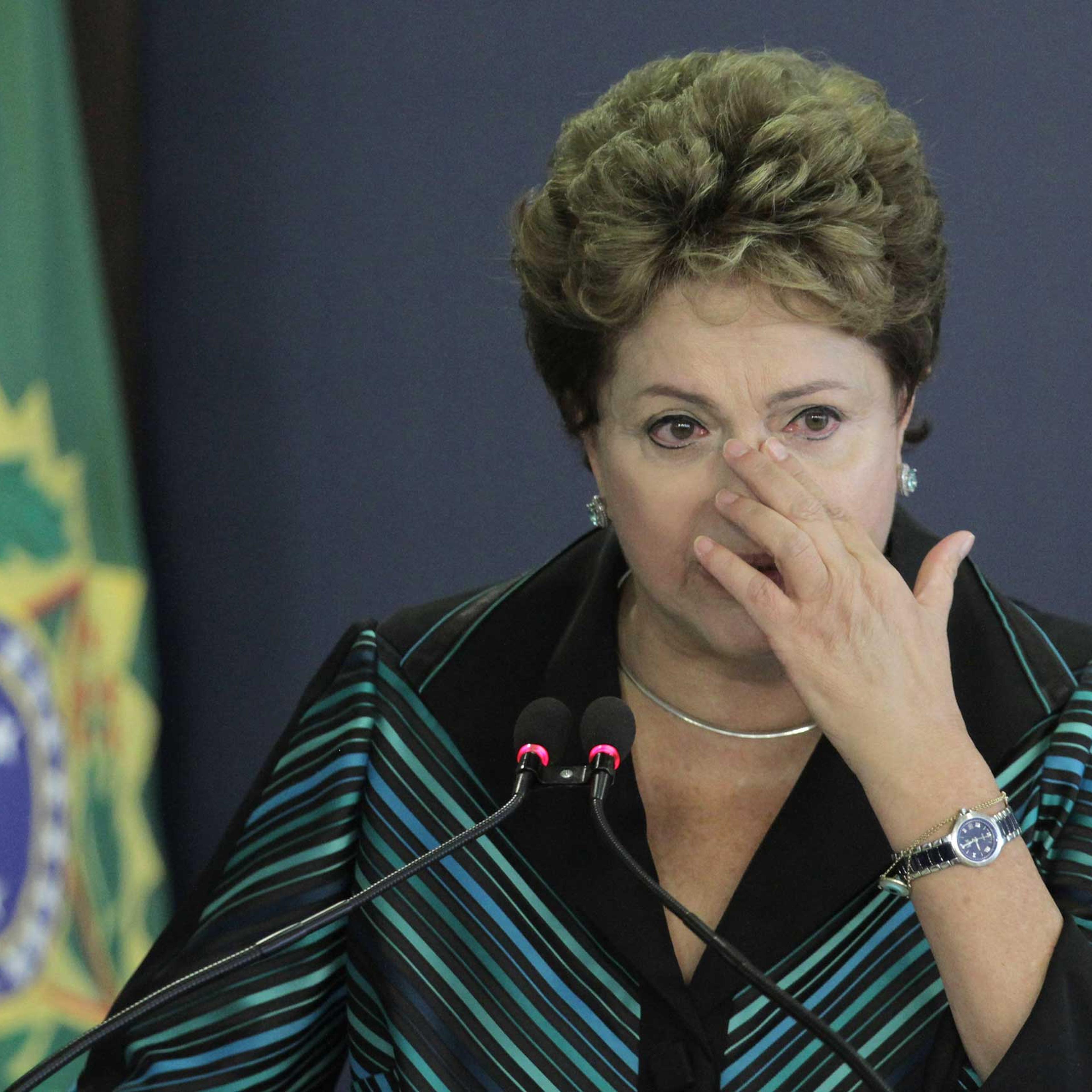 Brazil's President Dilma Rousseff cries during a speech at the launching ceremony of the National Truth Commission Report, at the Planalto Presidential Palace, in Brasilia, Brazil, Dec. 10, 2014.