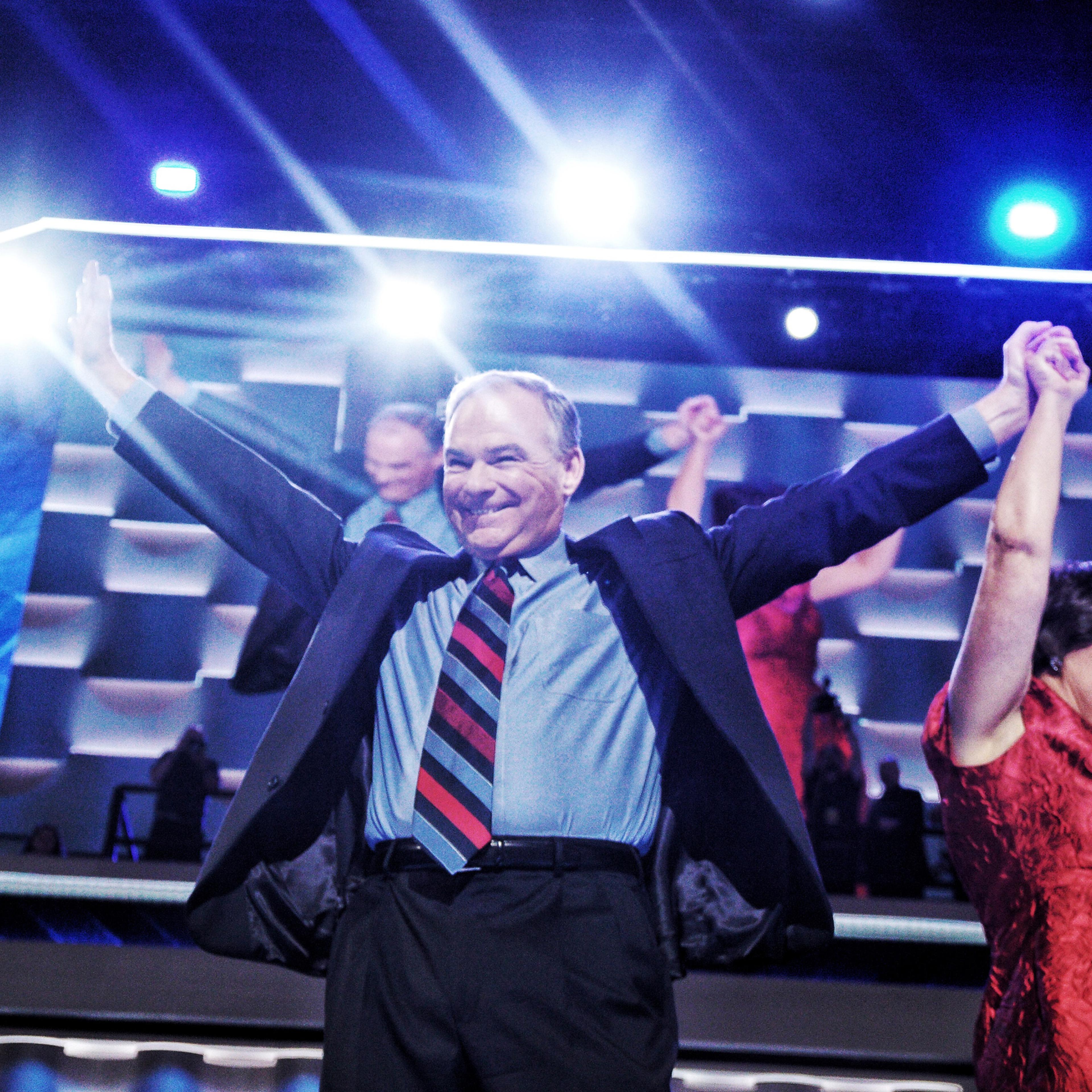 Tim Kaine holds his wife's hand at the 2016 Democratic National Convention in Philadelphia.